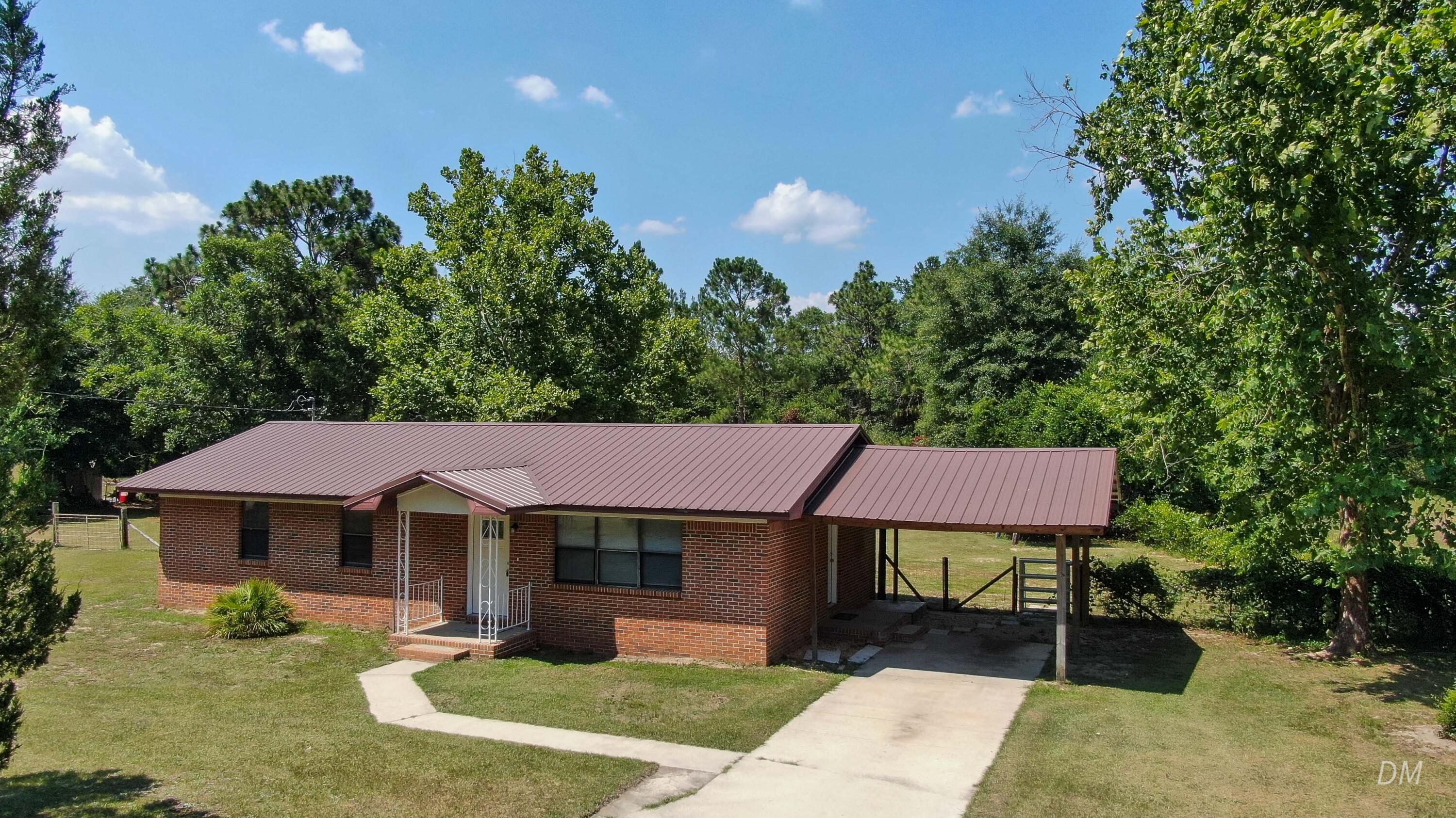 Brick 3 bed 2 bath just renovated on 1+ acre, located just east of DeFuniak Springs near Sawmill Court. Featuring completely renovated bathrooms, tile floors throughout, new paint, new water heater, new breaker box, new septic and new windows on order. Kitchen has new countertops, freshly painted cabinets and new appliances. There is also a metal roof estimated to be 6-8 years old. You'll find a huge 30x50 barn, which currently has disconnected separate circuit, water and separate septic (condition not guaranteed) which could be reconnected. Less than 10 minutes to downtown DeFuniak and only 40 min to the beautiful beaches of Walton County! Qualifies for all financing.
