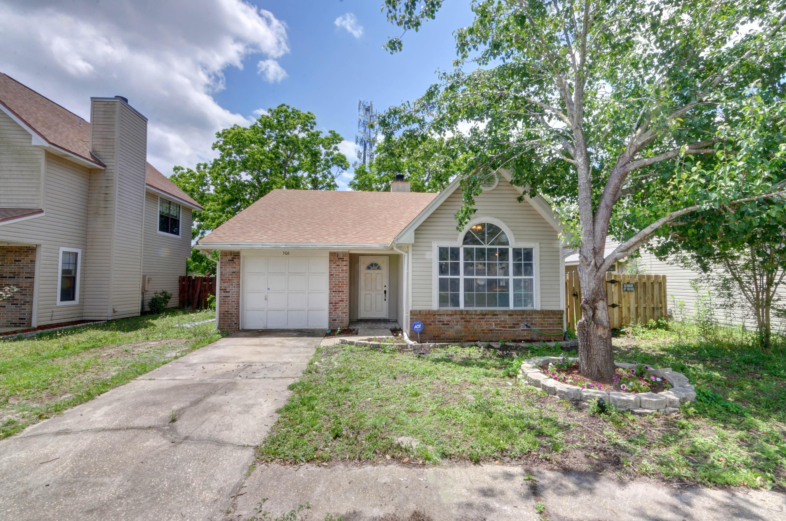 LOCATION LOCATION LOCATION! Only one mile from the front gate of Hurlburt Field this adorable home is located in the convenient Woodland Park Estates subdivision and even has direct access to a park! Clad in wood and vinyl siding with a roof installed in 2015 and an HVAC system less than two years old. You'll love the luxury vinyl plank flooring installed throughout the living room, hallway, and kitchen. The living room features a soaring raised ceiling and a wood burning fireplace, as well as sliding glass doors to the side patio (the master bedroom also has backyard access). The kitchen is adorned with windows on one side for great natural lighting at the eat in kitchen space, and it has granite countertops and stainless steel appliances. The three bedrooms have carpet, and both tile floored bathrooms have matching granite counters and bronze fixtures. Located in the fully fenced in backyard is a gate that conveniently leads to the park behind the home featuring basketball courts, playground equipment, and outdoor fitness equipment are also walking distance from home. Don't miss out on this fantastic location!
