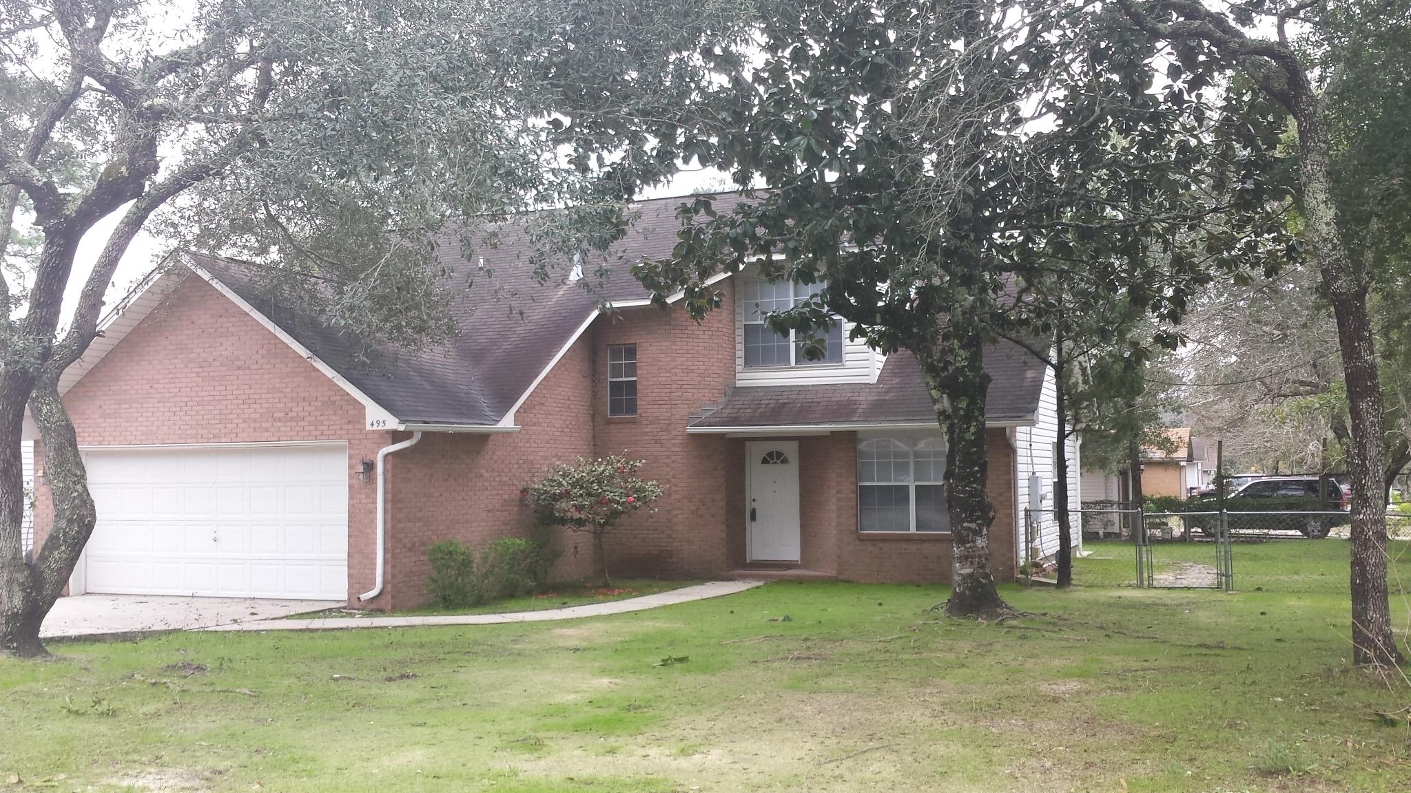 Contemporary home snuggled by new and mature trees on a corner lot!! Your new home offers a master bedroom on the first level and split bedrooms on the second. Downstairs has tile and pergo flooring throughout and new carpet on the second floor; kitchen has eat-in breakfast area; dining/living combination with lovely wood burning fireplace. Sorry no pets allowed.