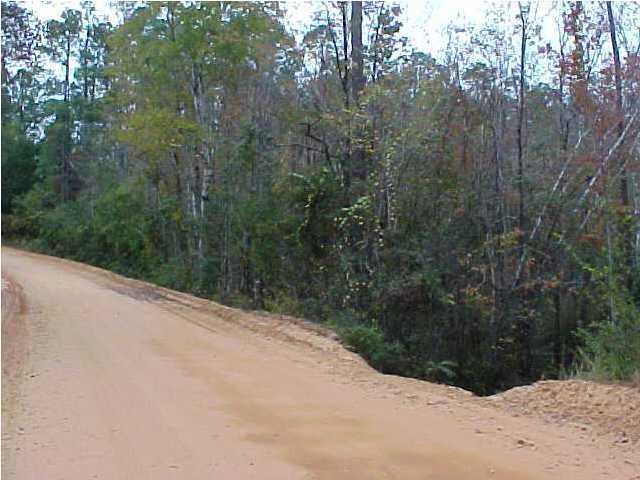 Just minutes from town .988 acre lot to build your new home~ Manufactured homes are allowed~