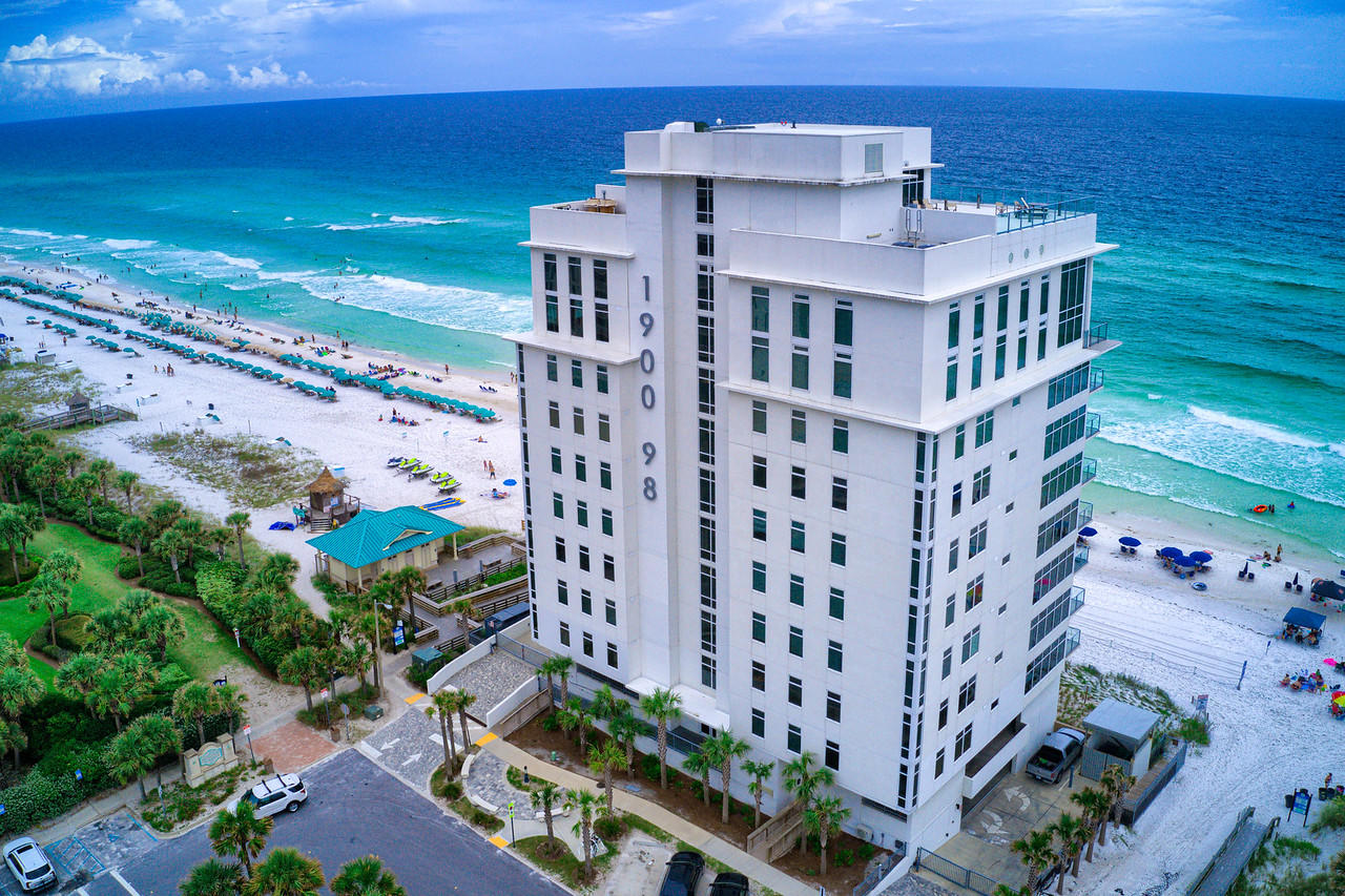 1900 Ninety Eight is Destin's newest luxury high-rise.  Experience panoramic views of the Gulf of Mexico from this contemporary condo comprised of of only 16 private residences.  Unit 602 faces the West with coastline views ranging for miles.  The spacious & open floorplan allows for an abundance of natural light through the expansive wall of windows, all controlled by Lutron Electronics.  Enjoy cooking on the Thermador kitchen appliances or the outdoor grill, while looking at the sparkling gulf waters.  This condo also offers an extra office space/creative nook.  Amenities include a rooftop pool, spa, fire pit and state of the art fitness center looking out over the gulf.  Also gated entry with heated/cooled lobby area & two levels of parking beneath the residences