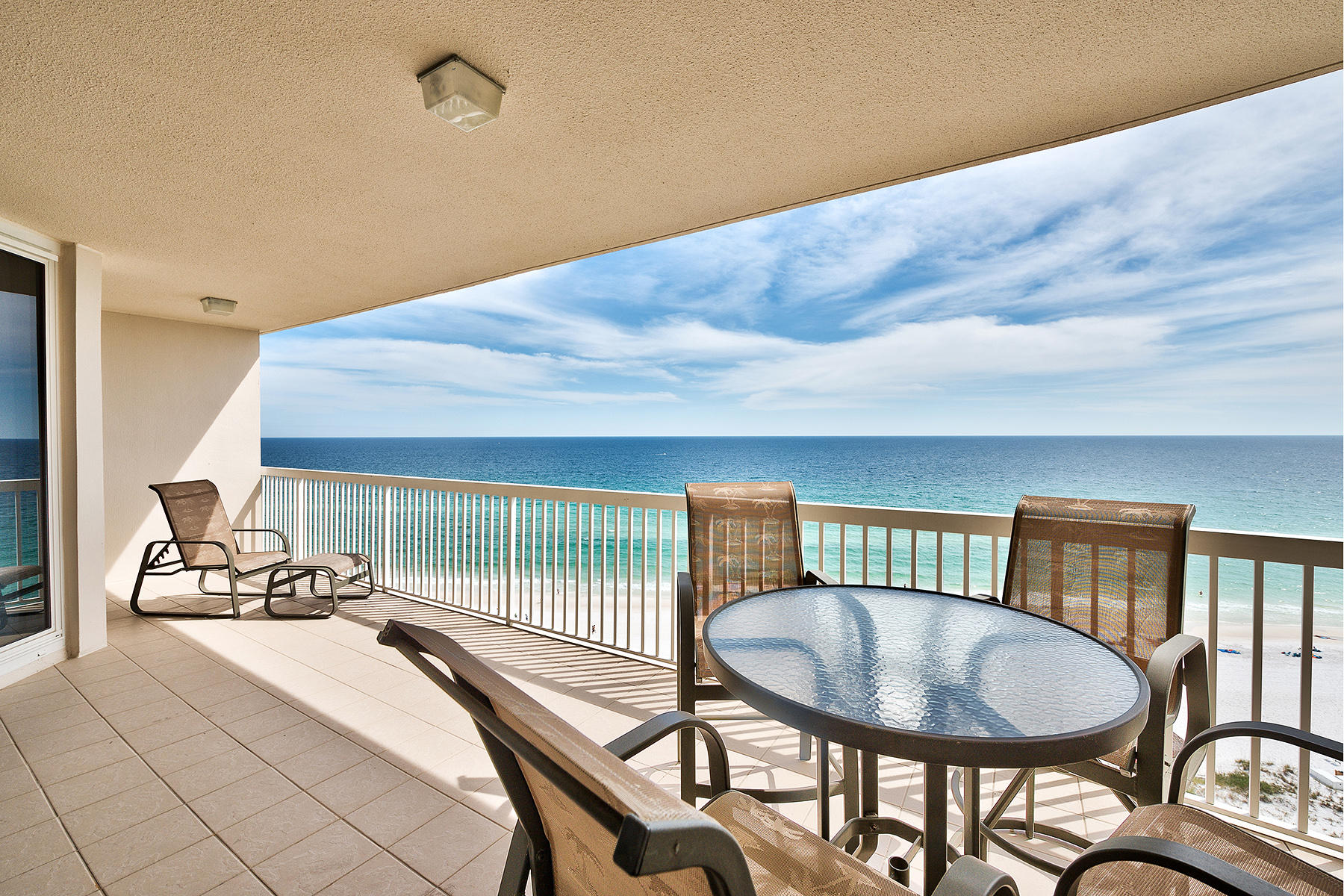 Sitting just below the penthouse levels in St. Thomas at Silver Shells, this non-rental unit offers especially well-elevated, direct views of the Gulf of Mexico to the south and southwest. A semi-private elevator opens directly into the unit. Stone floors stretch from the foyer and into the open living areas where they meet floor-to-ceiling sliding glass doors and windows framing views unique to Northwest Florida. A modern kitchen with granite counters and stainless steel appliances overlooks a bar with seating capacity for four or more into the adjoining living room filled with natural light by day, and the soft glow of contemporary pendant lighting by night. A cozy sitting nook off the kitchen is perfectly angled to capture golden sunsets over the water during the fall and winter months.