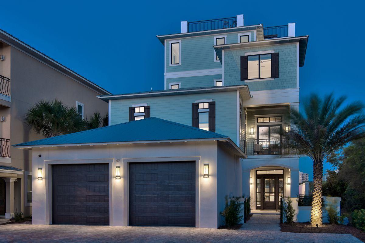 Completed in 2016, the ''Soggy Dollar'' is a sleek coastal contemporary masterpiece perfectly situated to capture panoramic gulf views from each of the four finished levels as well as the fifth story rooftop deck. This is the ultimate beach home; masterfully configured to provide unparalleled amenities and optimized for entertaining including a custom built boat bar outfitted with a wine cooler, ambient lighting, antique compass & flat screen television all resembling the nautical theme that is present throughout the home. The boat bar opens up to the 40,000 gallon watermark-built private resort style pool area complete with a swim up bar as well as an adjoining spa and covered outdoor summer kitchen & living area with gas fireplace and TV. Rental projections for this home are $500,000+ in gross annual rental income. Notable features include multiple indoor and outdoor living areas, private commercial grade elevator with access to every floor, dual master suites with gulf views and adjoining spa-like bathrooms with floor to ceiling calcutta marble, built-in pinterest style bunk beds, indoor and outdoor surround sound system as well as security cameras for optimal privacy. The first floor layout boasts dual bunk rooms, as well as two large bedrooms and adjoining baths as well as an industrial style game room complete with a custom boat bar & built in wet bar including a full size Sub-Zero fridge. The second floor is the focal point of indoor living space with a spacious living room featuring pecky cypress ceilings, floor to ceiling windows to soak in the beautiful gulf views, gas fireplace, built-in entertainment center and open to the massive dining area overlooking the pool. The kitchen features floor-to-ceiling custom cabinetry, paneled Sub-Zero appliances and Wolf professional series gas range, walk-in pantry and large center island with gorgeous shell infused custom countertops. The second floor also features a full bedroom with ensuite bathroom & half bath as well as access to the second story outdoor dining area overlooking the lagoon style pool. The third floor features 4 full bedrooms including dual master suites, laundry area as well as built in bunks for additional sleep ability. The fourth story is an unreal entertaining space outfitted as a game room featuring panoramic gulf views as well as a pinball machine, pool table, card table, flat screen TV, wet bar with GE Monogram stainless fridge, full bathroom & custom bunk room all open to the wrap around porch space. 

From the fourth floor, the spiral staircase allows access to the fifth story deck ideally outfitted with surround sound and furnished with lounge chairs and ample seating to allow panoramic views of the gulf of Mexico as well as the Choctawhatchee Bay. This home is in close proximity to gated community beach access as well as all of the world class shopping, dining and entertainment that Miramar Beach has to offer.