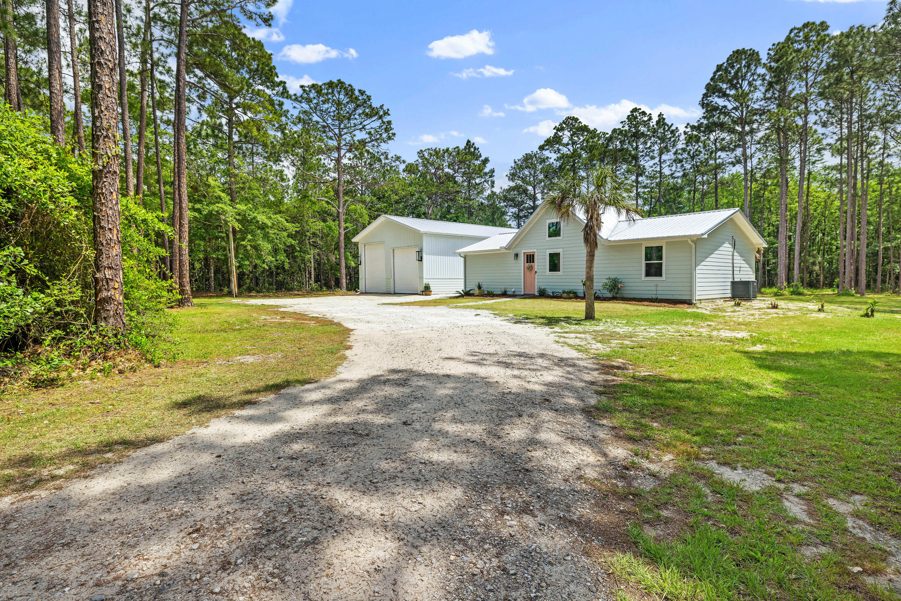 RARE FIND in Santa Rosa Beach! Newer home with 1.13 acres and a 30' x 60' Barn. This adorable 3 bed, 2 bath beach home with vaulted ceilings is truly unique. Perfect for someone that desires a large private lot with ample parking, beautiful scenery and plenty of room for a pool if desired. Situated a short distance away from a public park with bay access and boat ramp. In addition, this home is approximately 3 miles from the beautiful white sands and emerald waters of the gulf coast. So, bring your boat, RV, fishing gear, beach gear and enjoy the Florida lifestyle!