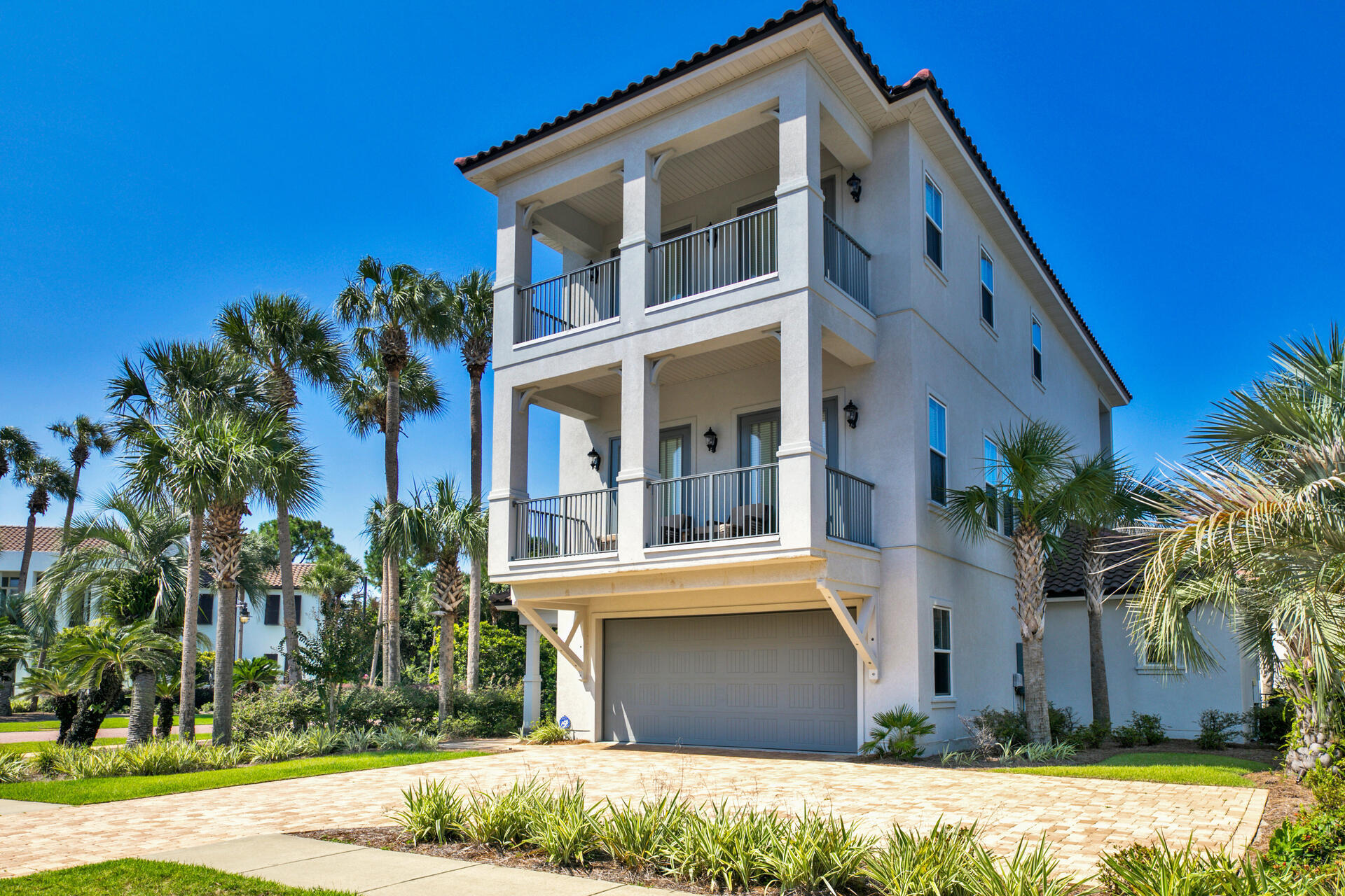 47 Tranquility Lane is a sprawling, six bedroom beach home that has impressive short term rental projections, is prominently located on a large spacious corner lot, and is just steps from the Gulf of Mexico in the prestigious Destiny neighgorhood. Gross annual rental projections exceed $250,000+. Enjoy family fun in your PRIVATE HEATED POOL with waterfall and hot tub after a perfect day at the beach! This gorgeous newer FULLY FURNISHED custom home comes complete with all decor, and is one of only four homes with DEEDED BEACH ACCESS. Notable features include an ELEVATOR providing easy access to all three stories, large two car garage, covered porches on each floor spanning the width of the home, and fire pit. The first level offers two bedrooms and a large game room. The second level features an open floor plan with a spacious chefs kitchen complete with stainless appliances and countertops. The second level also offers a large master suite complete with ensuite bathroom offering dual vanities, soaking tub and walk-in shower. The third level offers an additional three bedroom suites including a second master with fully equipped ensuite. Destiny is a gated community adjacent to the Gulf of Mexico flanked by coastal lakes and features tennis courts, gorgeous community grounds & pool area, entertaining space, and centrally located near world class shopping, dining & entertainment. The neighborhood is golf cart friendly so drive yours to the beach or out to dinner. Located on pedestrian friendly Scenic 98, you can walk down to the beach to catch a sunset or take a relaxing bike ride.