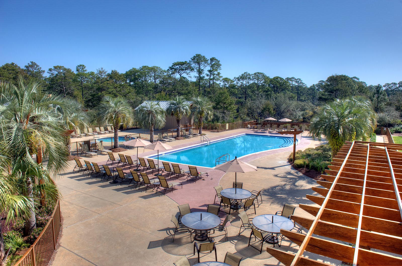 This Beautifully furnished spacious 3 bedroom,3 Bath condo is located in the highly coveted building 2 at Redfish Village. This unit has 1 deeded covered parking space and is a 30 second walk from the owners lounge and pool facilities. This unit features hardwood floors, granite counter tops, Viking and Jenn Air appliances. The unit conveys fully furnished with new furniture with an excellent rental history. Redfish Village is located in Blue Mountain Beach, and features beautiful condominiums that are ideal as a second home, a vacation property, or a year-round residence. This growing village community was specifically designed to connect residents with nature, and features a scenic trail along the wooden boardwalk down to the lake.