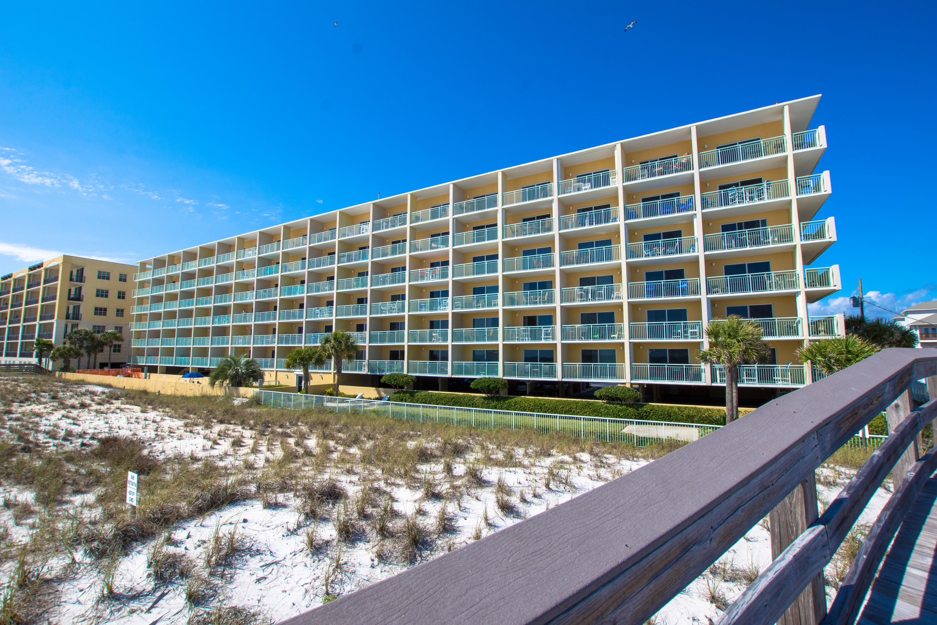 Corner unit beauty on the beach! This two bedroom/two bathroom condo has gorgeous gulf front views from the living area and bedroom balconies. This unit offers a wrap around lanai for gulf front relaxation. The two bedrooms share a balcony that offer amazing gulf views as well. This corner unit is 1,356 square feet for spacious living throughout. Pelican Isle amenities include 300 feet of deeded beach, community pool, hot tub, & workout room.