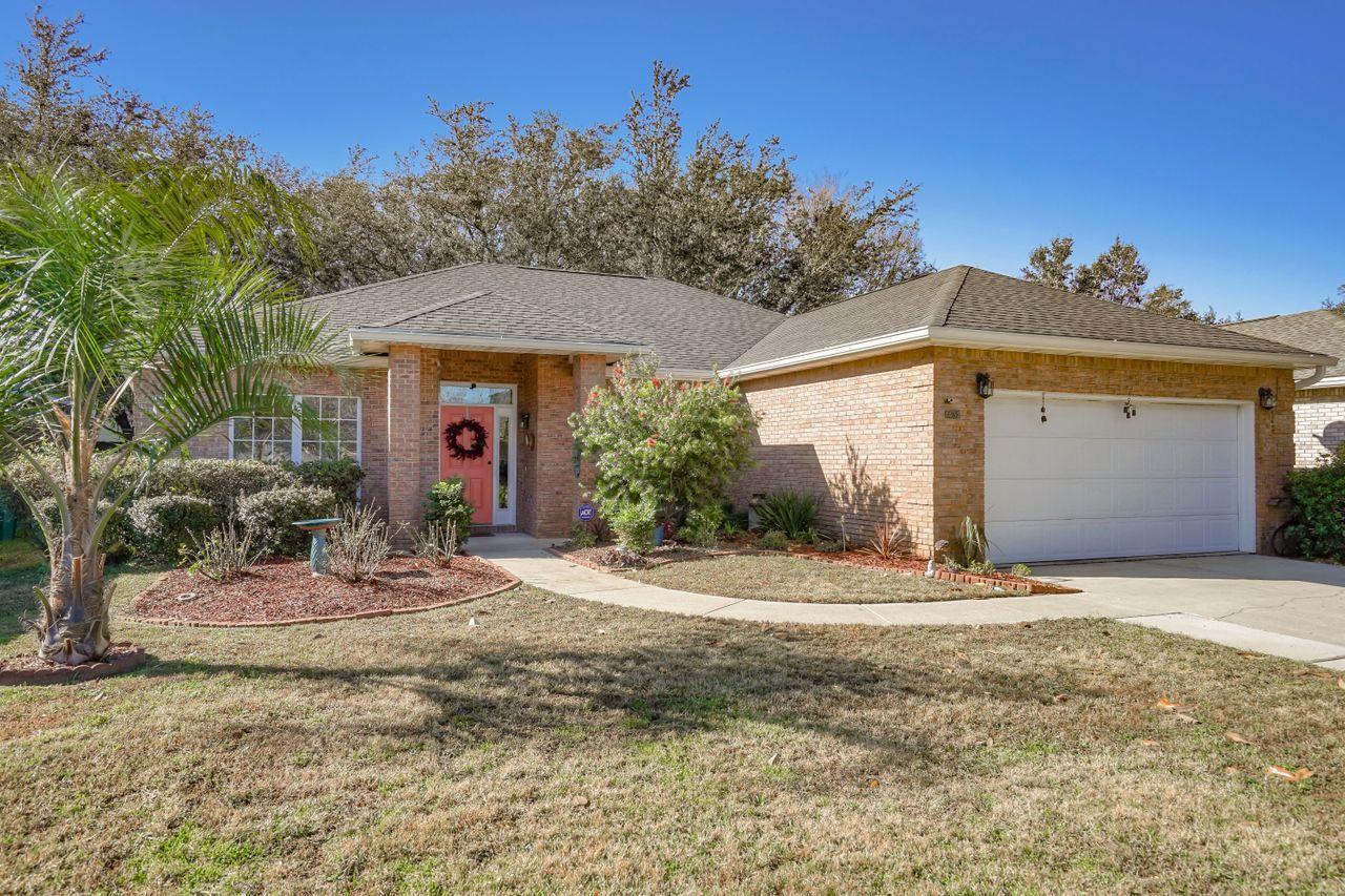This is the one you have been waiting for... all brick 3 bedroom 2 bath home with over 1700 sq. ft in a great neighborhood. Built by one of the local area's best builders, this home features a raised ceiling in the living room, open floor plan with a flex space that can be used as second dining, second living or office space. Airy and bright living room has corner gas fireplace and double French doors that open up to the screened porch.  The kitchen offers granite counters, a breakfast bar, and 42 inch beautiful wood upper cabinets. The master bath offers dual sink vanity, huge garden soaking tub and oversized separate shower. Master bedroom features a walk in closet and large bright windows. Roof was replaced in 2014, the water heater and refrigerator were replaced this year. Con't... This home is conveniently situated in the heart of Bluewater Bay with golf courses, tennis centers, marina, fitness center and pools within a short distance. Bluewater Elementary school is less than one mile and Ruckel Middle and Niceville High School are within 5 miles. Located between Eglin AFB and EOD school, with 7th Group accessible by newly opened bypass. There are several restaurants and stores within walking distance yet the home is tucked into a nice quaint subdivision. If you are looking for the best of both worlds, this is the home for you. **Association dues will be $120/qt for 2021**