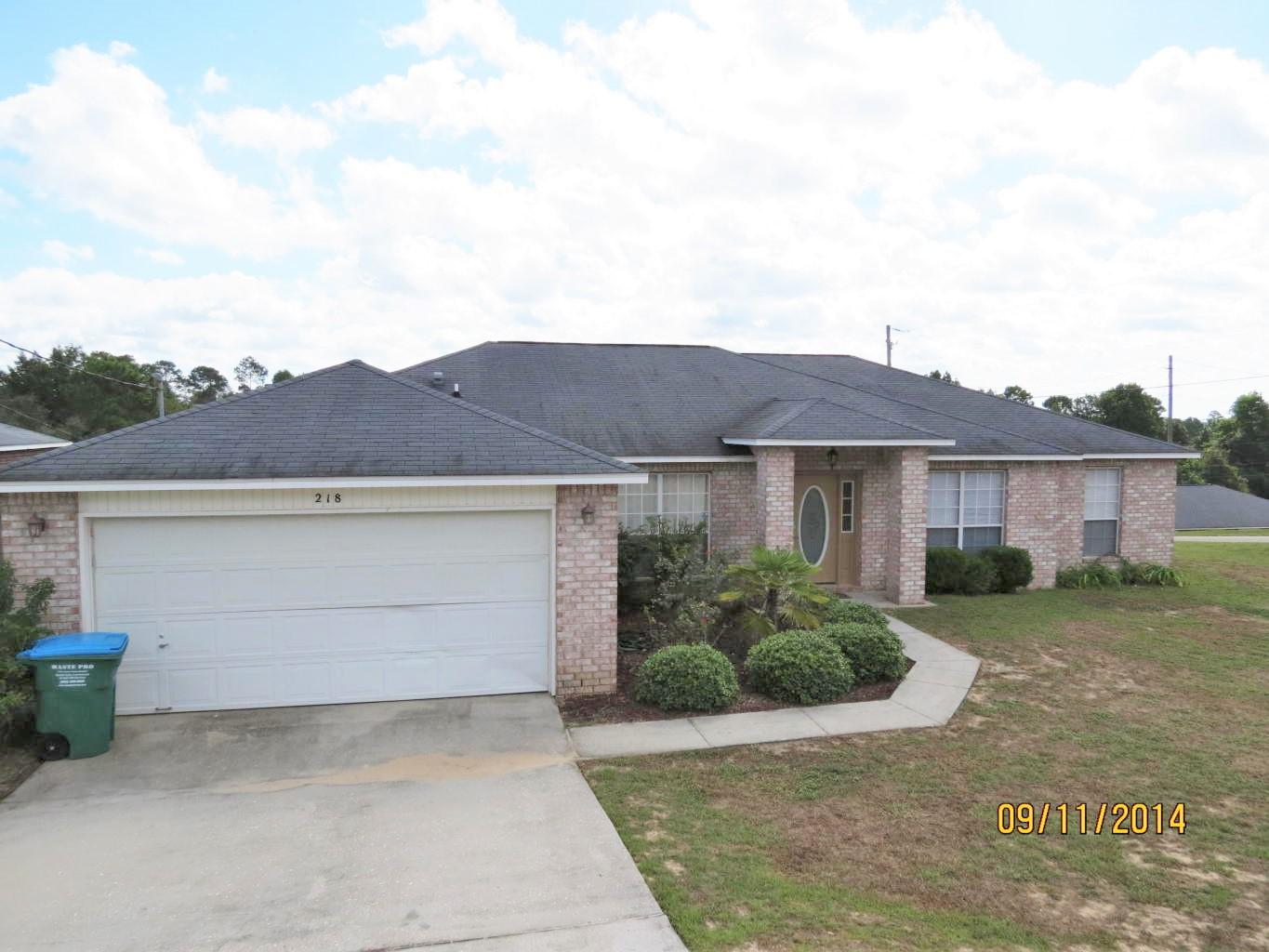 Available 3/6/2017...South Crestview home features easy commute and convenience to all bases, beaches & shopping. 4/2 Open concept living boasts dark wood flooring in the main living areas, kitchen island in the spacious kitchen, formal dining room or office space, split floor plan, large bedrooms, large laundry, eat in kitchen area, 2 car garage, and open back patio. No inside smoking. Pets will be allowed with a $400 non-refundable pet fee. Yard maintenance can be included with the rent for an additional fee. Sloping front and back yard.