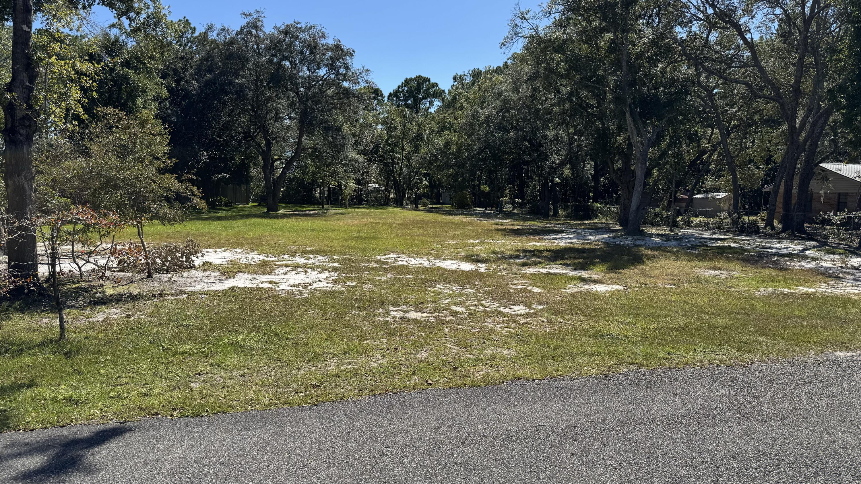 **Prime Canal-Front Lot - Perfect for Your Dream Home**

Nestled along a 75-foot canal front with direct access to Mallet Bayou and the bay, this .66-acre lot is the ideal setting for your custom build. The lot is flat and cleared, ready for construction, and features a canal-front dock and a cement boat ramp—perfect for boating enthusiasts. Canal is 5 ft deep at the launch ramp.
With a never-used septic tank already installed and an irrigation well in place, the groundwork is laid for a seamless build. This is a rare opportunity for a builder or homeowner to craft the perfect waterfront retreat in a serene, picturesque location.

Don't miss this exceptional property—it's a builder's dream come true!
