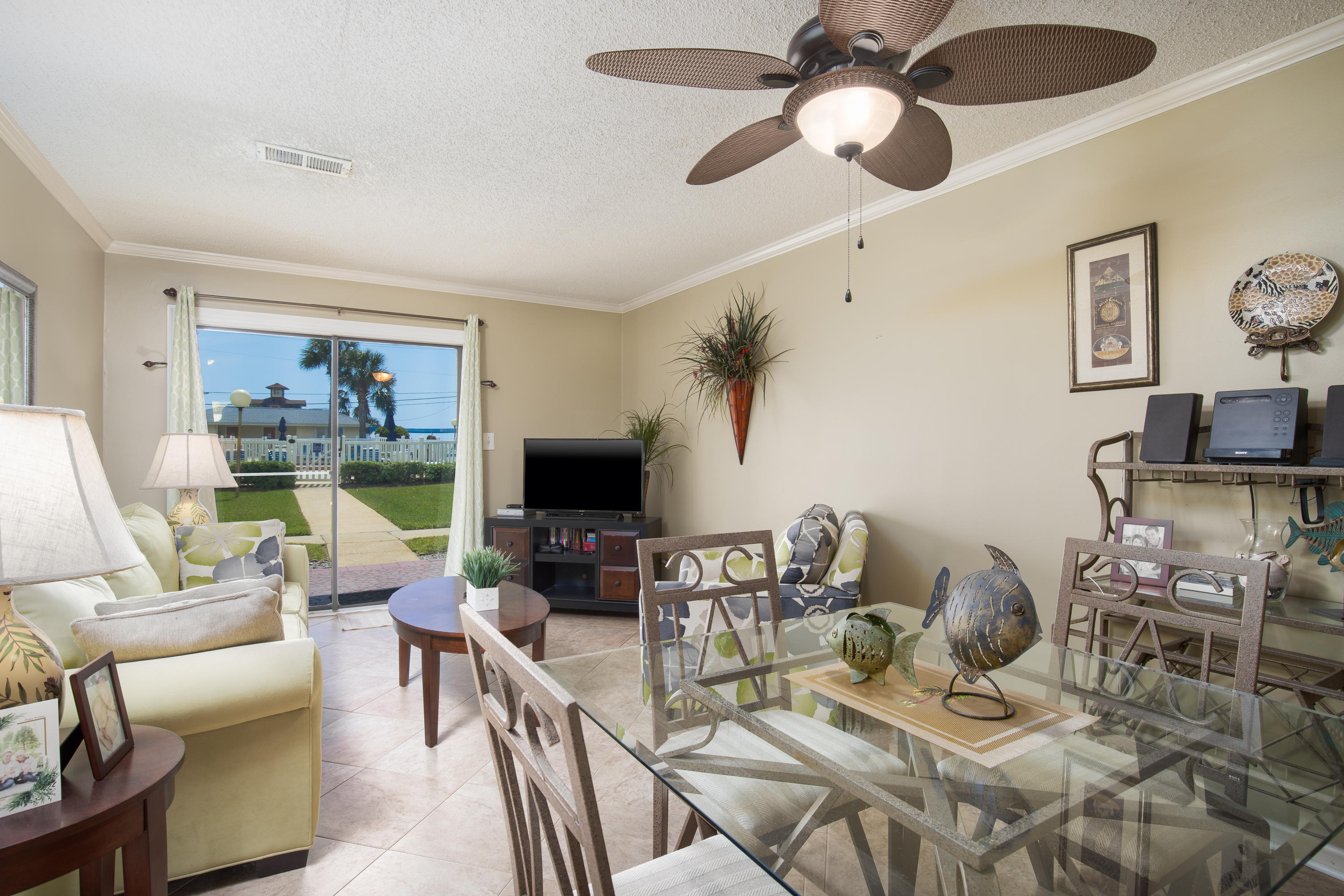 First floor & turn key vacation rental across from Pompano Joe's and from public beach access. Many new upgrades including paint, fans, hardware,and brand new TV's. This complex has 32 units with a large community pool with bathrooms, large green space, BBQ, picnic areas, and on site management. Unlike the rest, this first floor unit has it's own storage space and offers incredible Gulf views. Average power bill is less than $200 a month!!
