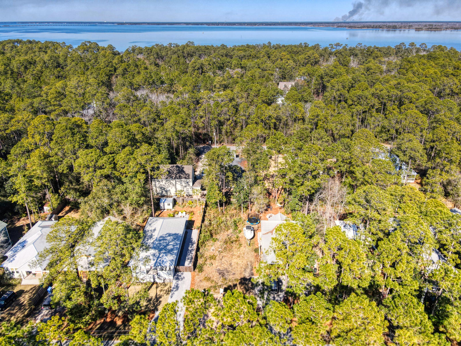 Attention Owner financing available!This recently cleared lot is in the heart of Point Washington.No HOA, no buildout time. Only 4 blocks from Choctawhatchee Bay and just 4 miles north of the white sands of Grayton Beach,Conveniently located across the street from Point Washington State Forest where you will find and enjoy many beautiful walking trails. Magnolia Beach S/D features dedicated water access at the shore of the bay, and has paved streets, county water and sewer. Call now to come envision your dream home on this perfect lot!
