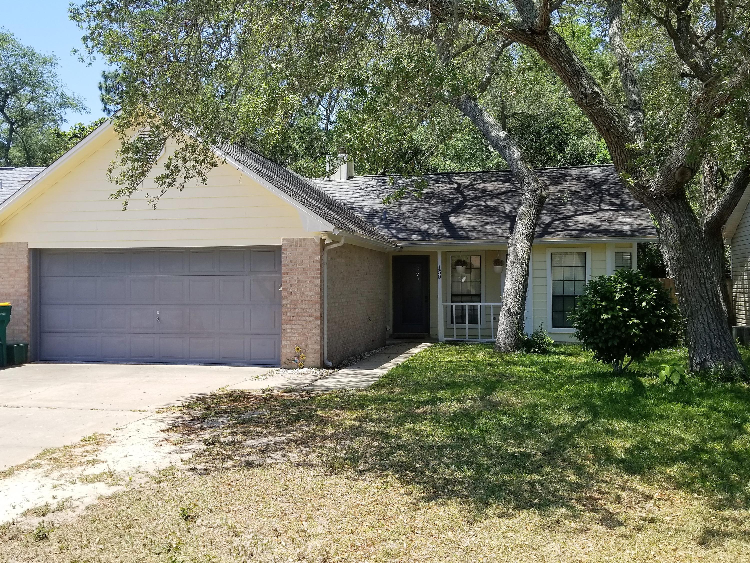 Cozy 3 bedroom 2 bath brick front home features Vaulted Ceiling, Split bedroom plan, tiled/wooden floors, fire place in the living area, separate dinning area, concrete patio outside and fenced back yard for privacy. This friendly neighborhood just east of White Point Road is located in the Bluewater Elementary School district. Short distance from the Mid Bay Bridge to Destin. Very close to Eglin AF Base, Duke Field and white sand beaches. Must see...