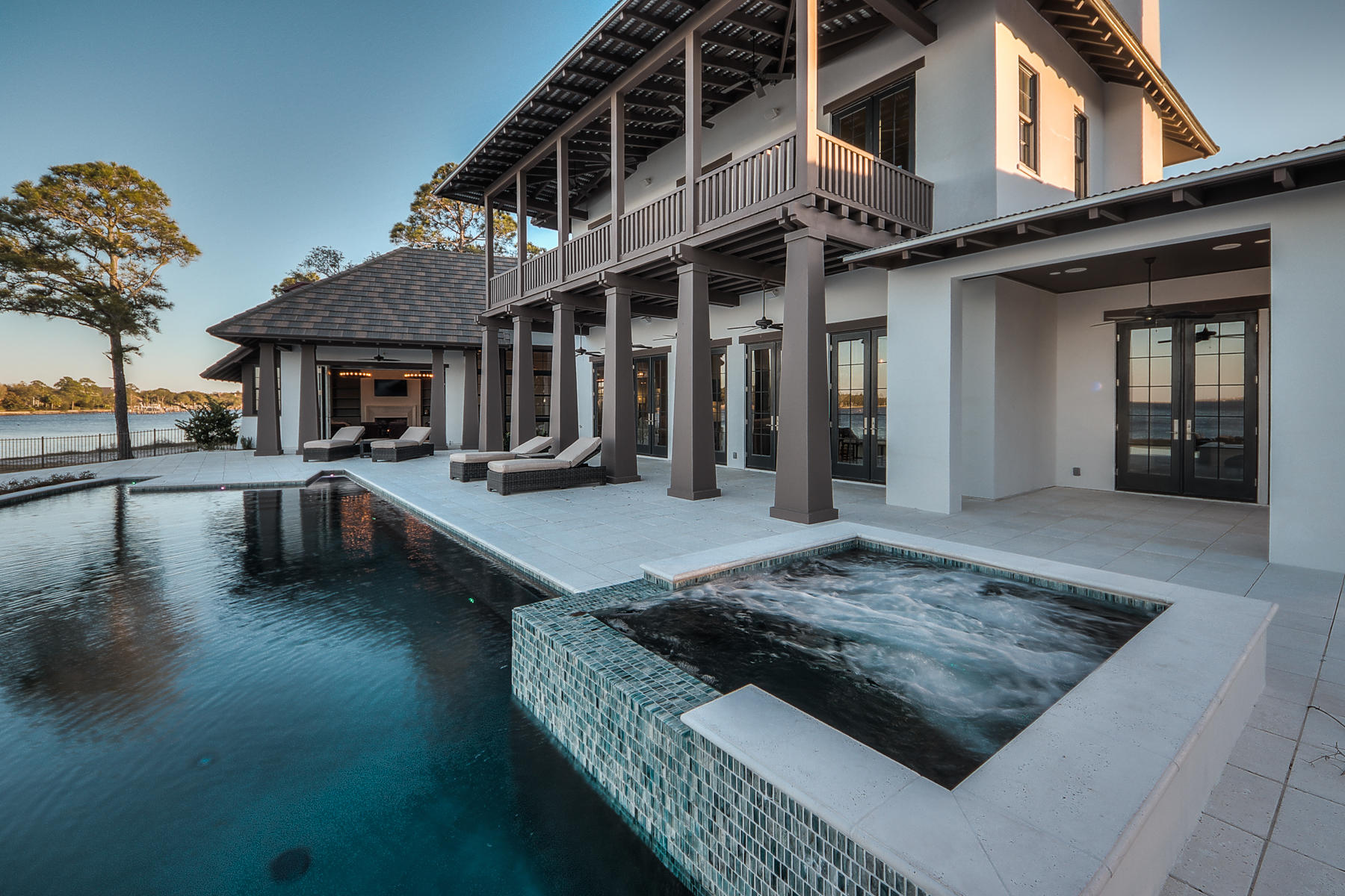 Opportunity knocks with this rare chance to acquire a luxury residence on a 0.67 acre lot overlooking Choctawhatchee Bay. Tucked away at the extreme east end of Indian Trail, the private cul-de-sac location of this Matt Savoie-designed residence ensures peace and privacy within the gated Estates at Indian Pointe. Owners will enjoy unsurpassed boating, fishing and luxury waterfront living from the 154 feet of private waterfront that this highly desirable lot affords. Designed with many one of a kind features, the home is planned around a gourmet kitchen featuring Calcutta Gold marble countertops and a butler's pantry. Top-of-the-range appliances include a Wolf oven and range, Sub Zero refrigerator and Bosch dishwasher. The living room has 12-foot ceilings and adjoins the formal dining room. Ideal for entertaining, the built-in wet bar boasts honed black limestone to complement the rich walnut counters. A comprehensive master suite occupies the remainder of the first floor with Turkish Patara limestone counters, Akdo tile and Palladium travertine flooring in the adjoining master bath. A gallery leads to the separate guest wing and pool room with cozy fireplace and screened porch. The interior courtyard provides a natural green focal point while the two-car garage is accessed by a breezeway. The second floor is devoted to further bedrooms and baths with access to the porch and balcony. Nearby Harborwalk Village puts high-end dining, shopping, seasonal entertainment and chartered fishing expeditions within easy reach of this unique bayfront home.