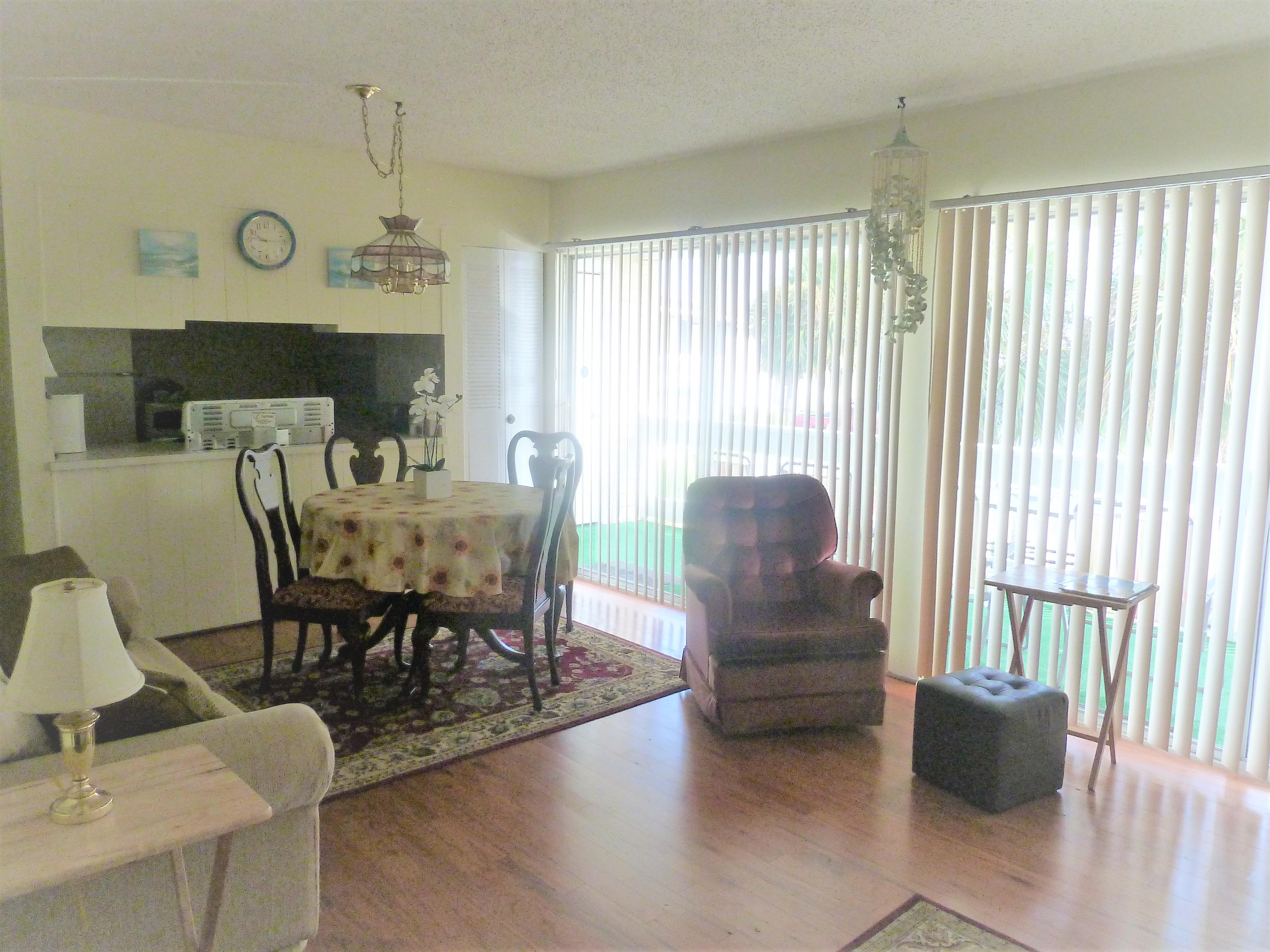 Cute 2 bedroom 2 bath. Looking over greenery & pool. granite counters, hardwood & tile flooring W/D New kitchen & new appliances. Furnished turn key.Great rental unit vacation or long term. Centrally located. Close to the Beach, Restaurants, Shopping & Entertainment. Amenities include: 3 pools, tennis, outdoor grills, community room, Buyer to verify all dimensions.