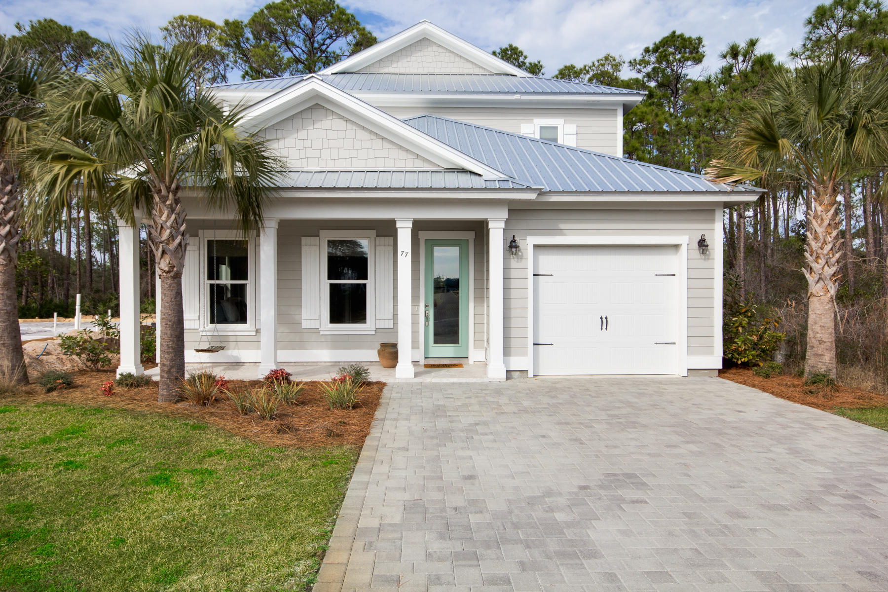 Framed by towering indigenous trees, this recently constructed home offers privacy, space and impeccable landscaping and workmanship. Walking distance to the beach with access to two private beach access points (separate annual dues). The main floor is a lovely open concept with adjacent living and dining spaces and an abundance of windows. A charming white kitchen over the granite breakfast counter features stainless steel appliances, a walk-in pantry and mint green glossy brick backsplash. Hardwood floors, contemporary ceiling fans, abundant recessed lights and horizontal 6-panel doors attest to quality craftsmanship. White trim throughout the home lends a crisp contrast to neutral pewter-hue walls. A single car garage adds to a convenient lifestyle. Contemporary bathrooms sport rectangular sinks, granite counters, stylish tile and glass showers, framed mirrors and fresh, white cabinetry. Lush, green grass and covered porches in front and back contribute to outdoor living space, and there's room for croquet, badminton or other fun backyard activities. The Villas of Frangista beach homes have been designed with the full time homeowner, frequent vacationer, or savvy investor in mind. The premier location in Miramar Beach is ultra convenient to the beach, shopping, restaurants and recreation. It's a gated community with cobblestone streets, a clubhouse and community pool, which is heated seasonally.