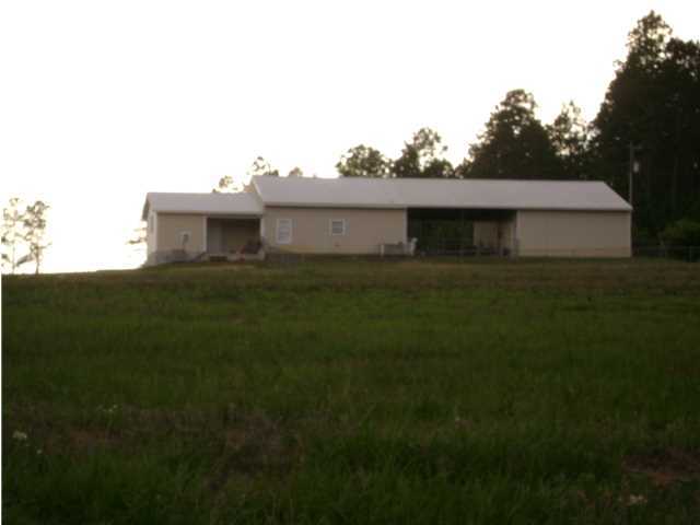 A GREAT OPPORTUNITY TO OWN A PIECE OF COUNTRY BEAUTY. PROPERTY IS 10.43 ACRES FENCED WITH A LARGE HOME SPLIT BARN. HOME OFFERS A LARGE OPEN LIVING ROOM, DINING AND KITCHEN PLUS LARGE UTILITY / PANTRY PLUS A BRAND NEW JUST BUILT IN 2013 MASTER SUITE AND MASTER BATH ON FIRST FLOOR WITH LARGE WALK IN CLOSEST. HOME ALSO OFFERS A DOWNSTAIRS BEDROOM AND A LOFT STYLE BEDROOM UPSTAIRS. KITCHEN HAS TONS OF CABINETS AND PLENTY OF ROOM, THE LIVING ROOM IS OPEN, AND THE HOME OFFERS A COUNTRY WELCOME. THE HOME HAS A LARGE COVERED CARPORT THAT SEPARATES HOME FROM THE BARN WHICH IS 41X78 AND OFFERS ROLL UP DOORS, UTILITY SINK AND ELECTRICITY INSIDE. PROPERTY HAS A NEW SITE BUILT POND PLUS ADDITIONAL BARN.