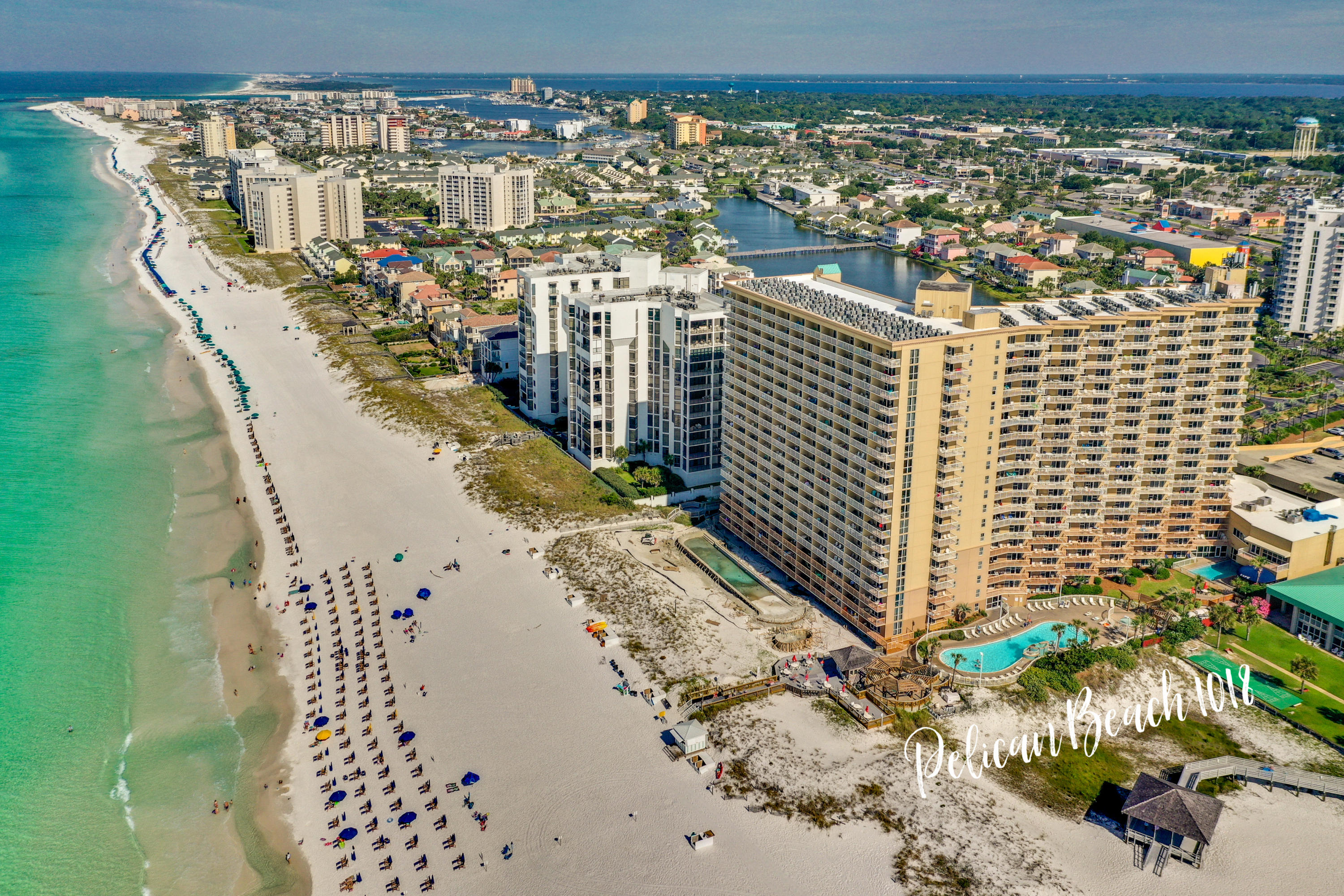 Known for achieving some of the top rental figures on the beach (rental projection up to mid $50K!) Pelican Beach is located on the famed beaches of Destin...which conjures up images of sun-splashed days of swimming, biking and relaxing. Revel in this super spacious 2 bedroom, 2 bath condo that sleeps 6. This condo has a renovated kitchen, Gulf front living room with extra SIDE WINDOWS for more views and natural light, and master suite, dining area, guest bedroom, large balcony and washer/dryer inside the condo. Stunning Gulf views and breezes from your supersized balcony. This condo is carpet free – updated white/grey tile floors throughout!  A well run association plus the best rental income on the beach! Conveys fully furnished and rental equipped. Centrally located to all the dining and entertainment Destin is famous for including spas, shopping, golf, fishing and more! Pelican Beach has amazing resort style amenities, including: now under construction: a huge new resort style zero entry pool and spa + sundeck is under construction, three additional swimming pools (one indoor), tennis, hot tub, beachfront grill, fitness center, arcade, building security system with cameras, upgraded cable and super high speed internet, on-site cafe and market, 24 hour reservation desk, convention/meeting services and covered parking garage!