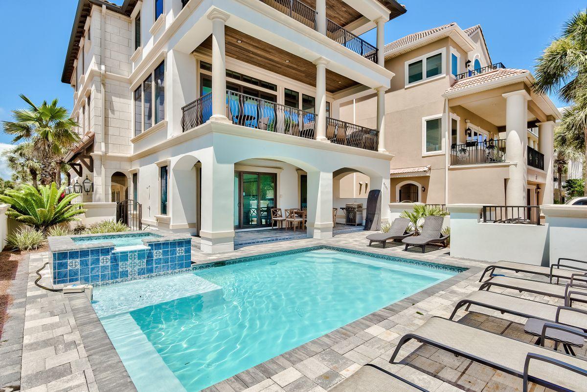 Sleek coastal contemporary architecture juxtaposed prominent beachside positioning one tier off the Gulf of Mexico characterize this exceptional residence in the prestigious guard gated Destiny by the Sea. This exemplary retreat offers excellent vacation rental opportunity with over $300,000 in projected annual income as well as notable resort amenities including a sizable south facing private pool & spa adjacent to neighborhood exclusive deeded beach access. Recently built in 2017, this home offers an impressive three story vertical footprint and open floorplan with inverted living to take advantage of incredible gulf vistas. The second story living layout is accentuated by floor to ceiling glass windows overlooking the emerald green waters of the Gulf of Mexico anchored by a finely appointed chef's kitchen with professional series appliances and custom cabinetry. The oversized living and dining room is adjacent to the kitchen and offers direct access to the south facing covered balcony. The primary master bedroom is well positioned on the third story and offers pinnacle gulf views from this impressive suite and includes an ensuite spa-like master bathroom with Egyptian marble throughout, walk-in shower, dual vanities and beautiful views. Other notable features include a private elevator, dual garage stalls and ample parking, gas lanterns and thoughtful furnishings with curated design work by Marisol Gullo. Destiny by the Sea is a gulf front guard gated neighborhood in the heart of Destin Florida with excellent proximity to world class shopping, dining and local entertainment.