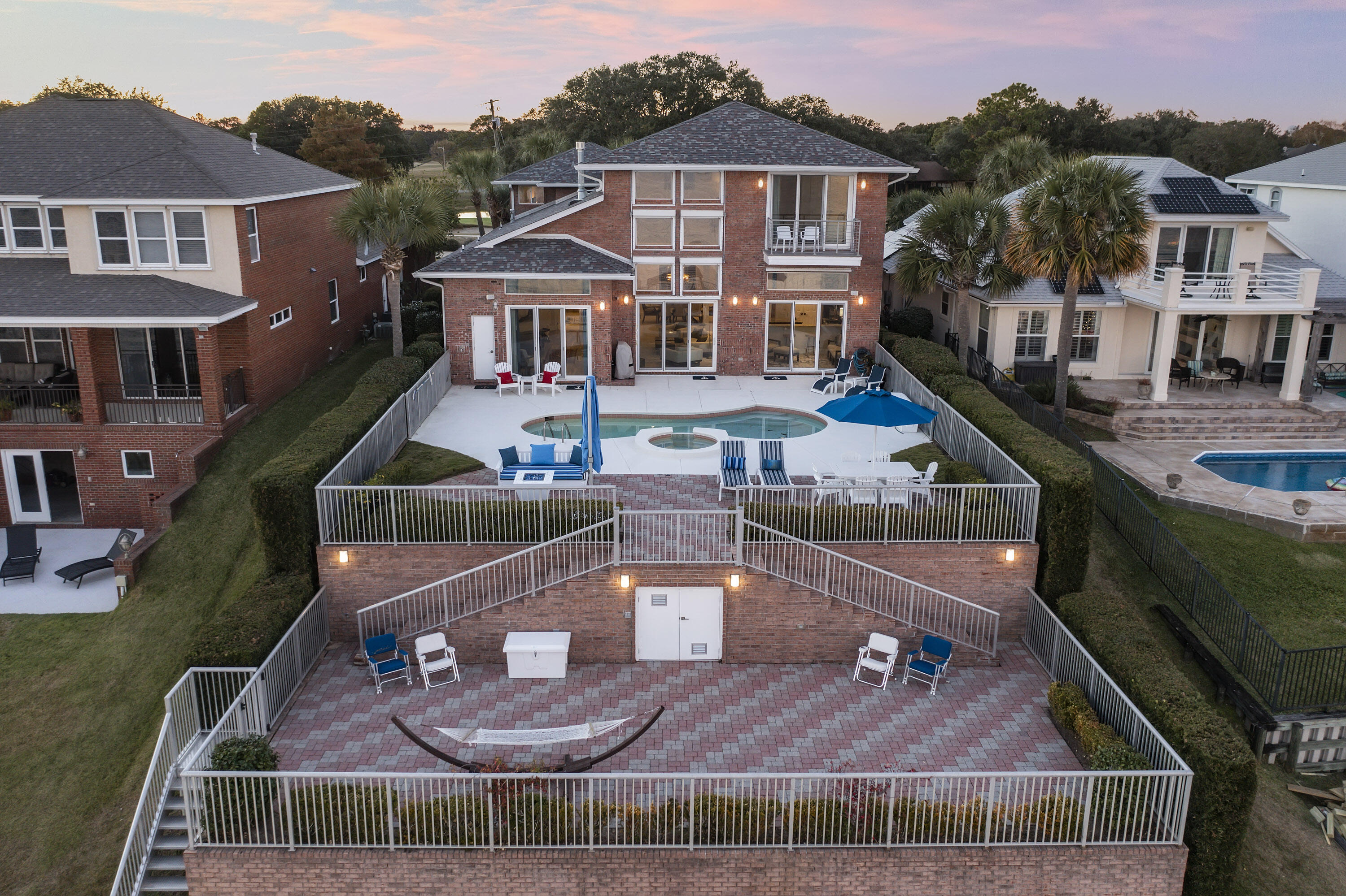 Prepare to be wowed by the views! This stunning all-brick, bayfront home is the complete package as it has it all! Offering the most spectacular and expansive Bay front views, this incredible luxury home offers a fabulous heated pool & spa w/ tiered patios, grill area & decks for entertaining, and fully equipped 660 square ft. guest apartment over the 3 car garage with its own entrance. The first level features soaring two-story tall ceilings, floor to ceiling windows with sliding glass doors, custom gas fireplace, custom made Italian draperies On the first level you'll find the primary suite with built-in bookcases, a huge walk-in closet, and an en-suite with glass bowl sinks, custom back-lit mirror and designer pendants. Offered fully furnished. You'll also find the kitchen and living areas showcasing the expansive bay views, as well as a formal dining room, and an office.  The second level features two guest rooms and a bonus room.  The pool deck overlooks the Bay and features a heated pool/hot tub as well as a pool bathroom. One level down is a large sun deck. The boat dock has recently been completely upgraded to include a flo thru dock, new pilings, new boat and jet-ski lifts, deck ladders, as well as new electrical and plumbing service to it. The roof for the boat house was just replaced, and the sea wall and rip-rap have been updated as well. This home is located just steps away from the Shalimar Pointe Golf Club, which features an 18-hole Dye-Finger design that takes advantage of the natural surroundings and is one of the best kept golf secrets in Northwest Florida. The club is also home to a comprehensive practice facility featuring a spacious driving range, putting green, and chipping green.  This is Florida living at it's finest!

2020/2021 Renovations and Upgrades:
New sliding glass doors, new custom gas fireplace, new roof (Jan 2021), paint, dock, HVAC system, and water heaters.  Other recent exterior updates to the home include new aluminum staircase, new gutters, brick sealant, landscaping and landscape lighting, and an outdoor shower.  Interior updates include all new guest bathrooms with custom showers and tile, complete interior repaint, LED can lights, new light fixtures in the dining room, kitchen, and foyer, stair runner, and new speakers.