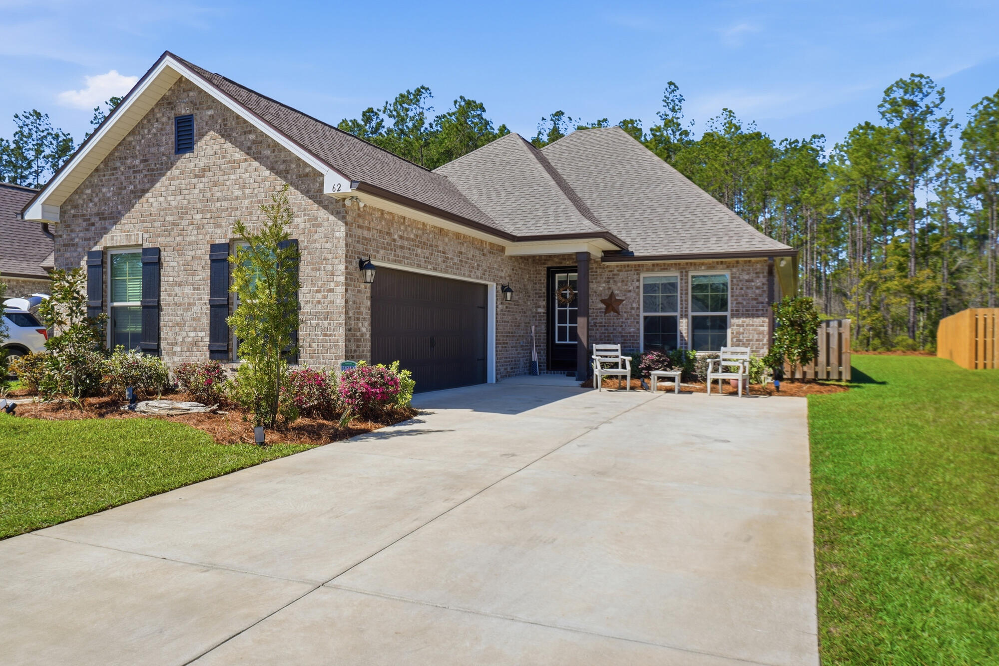 Exceptional Move-In Ready at 62 Brilliance Blvd. To make this an even more enticing opportunity, the seller is offering a $5,000 credit at closing, which can be used toward closing costs, a new fence, or a patio extension prior to move-in. While many are waiting months for new construction in this rapidly growing community, this stunning Manet II NEW residence is available now. Built in 2024, this home offers the pristine feel of a brand-new build without the construction timeline. It has been lightly lived in--less than two years old--and is ready for you to start enjoying the Hammock Bay lifestyle today. 

Expansive Living and Natural Privacy. This floor plan is a standout for its large, open-concept living area, arguably the most spacious living room design offered by the builder. It provides an airy, inviting atmosphere perfect for hosting or quiet evenings at home. Step outside to a spacious backyard that backs up to a peaceful nature preserve, allowing you to enjoy the ultimate privacy and tranquility that nature offers. 

Premium Interior Upgrades. The owners invested nearly $18,000 in high-quality options to elevate the home's comfort and style: 
- Gourmet Kitchen: Anchored by Vico Stone Arctic White Quartz and a premium Tier 2 Cabinet upgrade. 
- Designer Finishes: Enhanced with undercabinet lighting, a Trinsic Stainless Steel faucet, and a stylish NAL Santorini backsplash. 
- Master Suite: The bedroom features a sophisticated tray ceiling, adding a sense of height and refined comfort to the space. 
- Abundant Storage: Features a "his and her" configuration with two spacious walk-in closets, ensuring plenty of room for any wardrobe. 
- Upgraded Flooring: Durable and elegant Ceramic 5 tile flows through the living room, hallways, master bedroom, and all wet areas. 
- Custom Lighting: Features 12 additional LED canned lights, pendant lighting over the island, a decorative foyer fixture, LED interior ceiling fans, and five additional interior electrical outlets. 

Quality Exterior Construction. The home's exterior is designed for both aesthetics and long-term durability: 
- Full Gutter System: Musket Brown gutters encompass the entire home. 
- Classic Materials: Finished with Columbus Stone Chase brick and Estate Linen siding. 
- Refined Entry: Features a Wayne Dalton Sonoma garage door in Brown and additional LED coach lights on each side of the garage. 

The Hammock Bay Lifestyle. Located in Freeport, you are only 22 miles from the famous 30A beaches and minutes from the bay for boating. This home offers the perfect blend of modern sophistication and resort-style amenities. Ownership here includes access to exceptional neighborhood amenities: 
- Creekside Clubhouse: Features a resort-style swimming pool, fitness center, and pickleball and basketball courts. 
- Windmills Town Center: Offers three additional swimming pools and an expansive 8,000 SF fitness center. 
- Owners' Club: A premier social space with a theatre and indoor/outdoor entertaining areas. 

This move-in-ready gem represents exceptional value. Why wait for a build-site when you can have it all right now? 

Note: All information provided is deemed reliable and accurate, but is not guaranteed. It is the responsibility of the buyer and the buyer's agent to verify all measurements, community amenities, and property details.