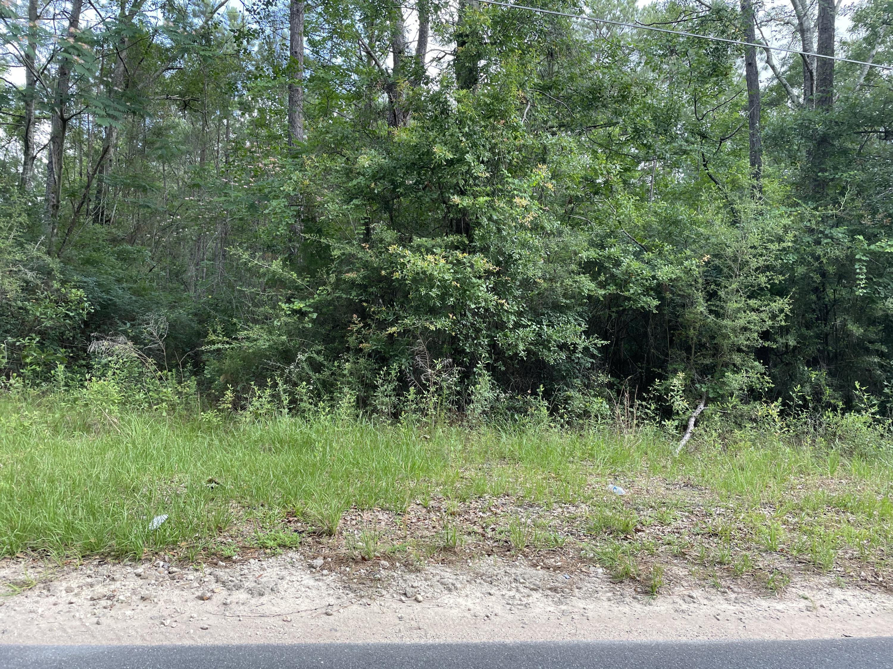 This 3.68 acre heavily wooded parcel on Lighthouse Church Rd.  a county maintained paved road, with Baker Water available at street.  This property is about 10 miles from town, has the ease of country living with the convenience of town.  Bring you builder, plans and build your dream home.