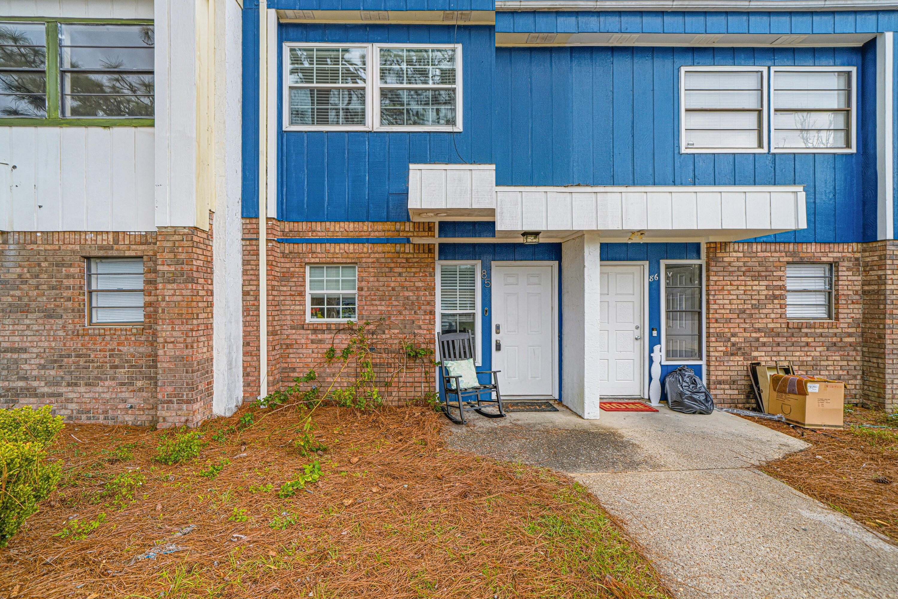 Step into this gorgeous, fully furnished townhome where coastal style meets modern comfort. From the moment you enter, you'll be drawn to the stylish kitchen featuring granite countertops, a coastal-inspired backsplash, and a layout perfect for both everyday living and entertaining.  The main level offers a spacious living room with updated recessed lighting, a convenient half bath, a large pantry/owner's closet, and a private bedroom with a walk-in closet—ideal for guests or a main-level retreat. Step outside to your private backyard space, perfect for enjoying morning coffee or unwinding after a day at the beach.  Upstairs, you'll find two additional bedrooms, an updated full bathroom, and a generously sized laundry room for added convenience. Beautiful LVP flooring throughout the home provides durability, easy maintenance, and a clean, modern look.  All furnishings convey with the exception of the King mattress upstairs, and the home has been professionally furnished by an interior designer to maximize comfort and appeal making it an exceptional primary residence, second home, or investment property.  Even better, there's NO HOA, and major systems have already been updated: new roof (2025), hot water heater (2025), HVAC (2026), and new fence (2025) giving you peace of mind for years to come.  This move-in-ready gem offers style, functionality, and freedom with no HOA restrictions.  Don't miss your opportunity to own a beautifully upgraded, turnkey townhome.