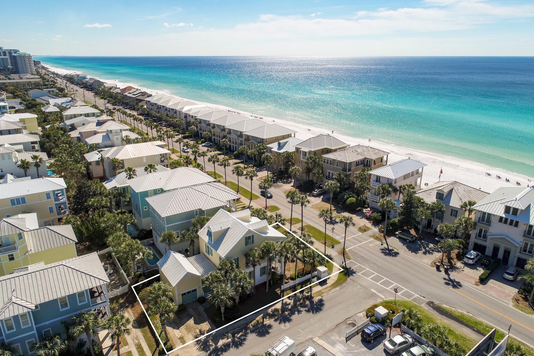 Prominently located on an expansive corner lot directly on Scenic 98, this bespoke coastal retreat offers expansive south facing porches with beautiful gulf views as well as convenient deeded beach access and excellent investment potential with $110,000 in projected annual gross rental income. Architecturally refined with thoughtful design, this well-maintained five bedroom home is situated in a premier location in Frangista Beach allowing for immediate gated community beach access as well as side entry parking with optimal ingress and egress from Hollywood Street highlighted by a detached one car garage with loft space that can be converted to additional living area if desired. The interiors have been recently re-painted and updated to include hardwood flooring, updated appliances and new designer furnishings creating a fresh coastal design palette. This outstanding floor plan takes full advantage of it's beach side positioning allowing for gulf views from the first level which is highlighted by an open floor plan complete with an expansive living area including 10' ceilings, dining room and chef's kitchen complete with stainless appliances and hardwood flooring throughout. The first level also offers a full king suite with ensuite bathroom as well as rear covered porch space with ample privacy. The second level is highlighted by the south facing oversized master suite offering easy access to the covered porch as well as a large ensuite bathroom. There are three additional bedroom suites located on the second and third floor, each allowing for optimal privacy and comfort; perfect for a family retreat. This exemplary home is located in the heart of Frangista Beach and Scenic Highway 98 with close proximity to world class dining, shopping and entertainment.