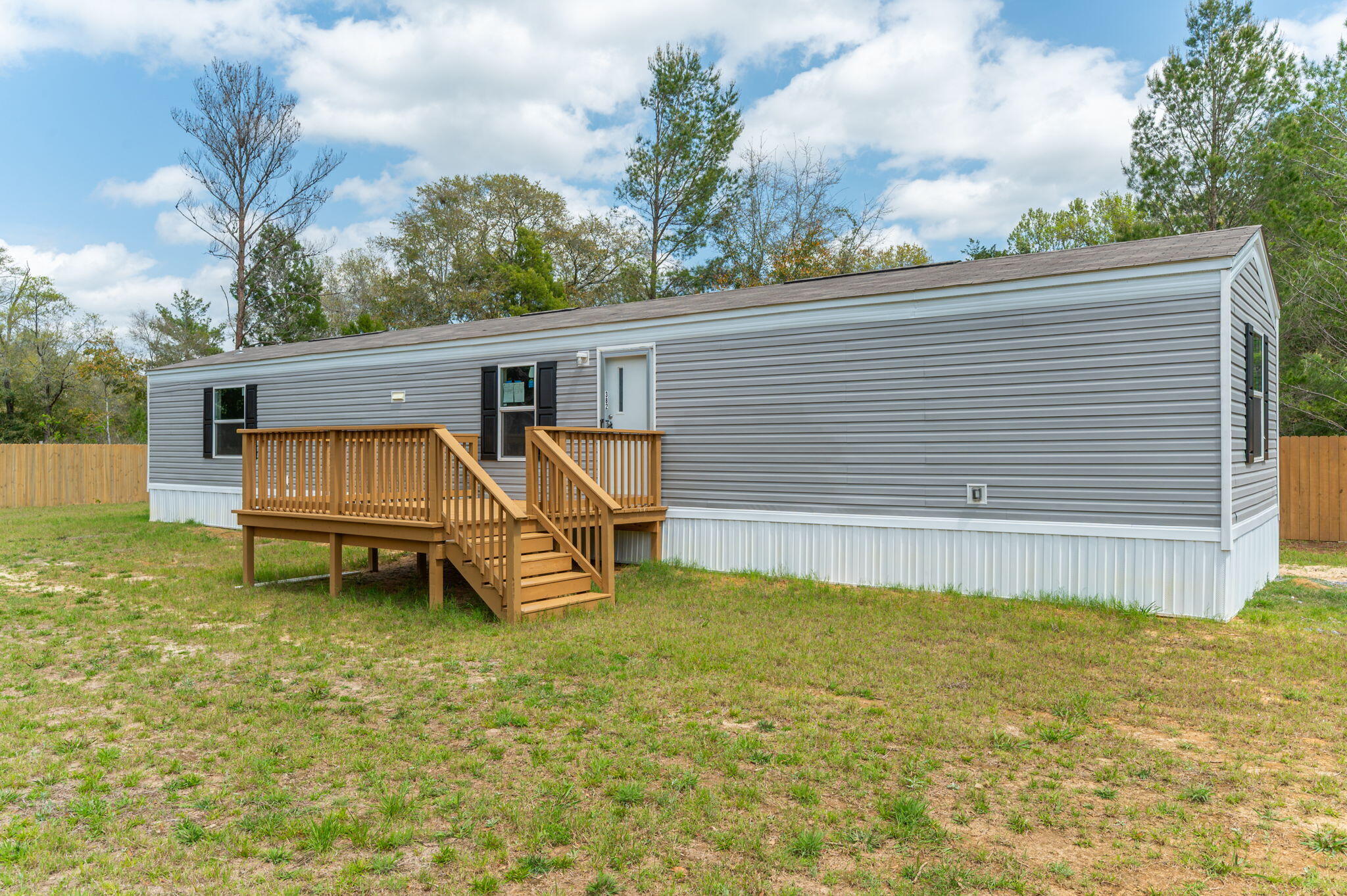 Discover this brand new mobile home in Defuniak Springs, FL. Perfect for first-time homebuyers, this charming 924 sqft residence offers 3 BD and 2 BR in a practical designed for modern living. Step outside to enjoy your morning coffee on the new front deck,. Just a short drive to beautiful Florida beaches and Airforce bases, this home balances peaceful living with accessibility to attractions and employment centers. The thoughtfully designed primary bedroom provides a peaceful retreat while the entire property delivers value and comfort without compromise. Why rent when you can own this move-in ready home with all the essentials for starting your homeownership journey? Schedule your viewing today!
Options to help with closing cost assistance with approved credit through various lenders.