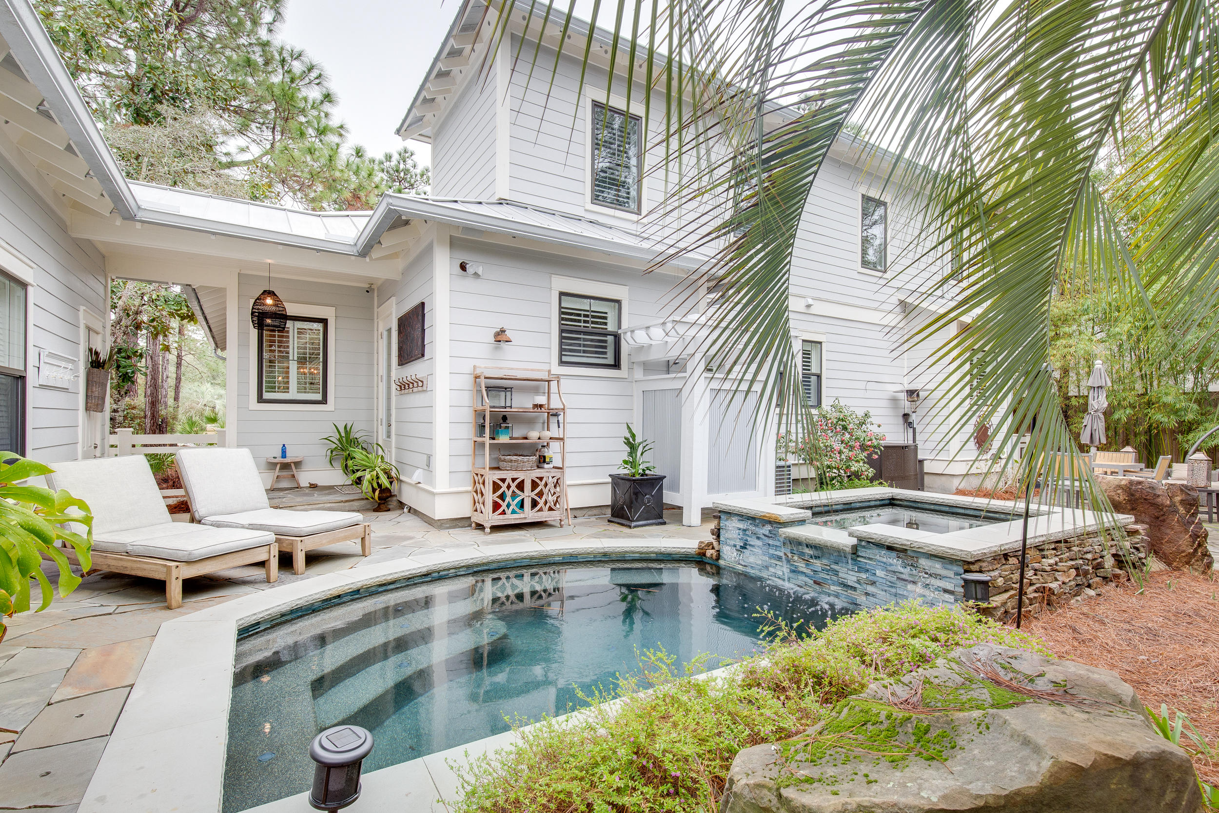 Conveniently located within walking & biking distance to Seaside, Watercolor and our various restaurants & shopping on 30A this charming custom built Seagrove home is not to be missed.  Open living at its best with living, dining and kitchen all in one large inviting space.  This home has travertine & engineered hardwoods throughout. Master bedroom is located conveniently on the first floor with large master bath, featuring air jet tub & large shower and  separate water closet.   Upstairs you will find 3 bedrooms one of which is a bunk room.  There is generous outdoor living spaces as well, including a large screened in porch overlooking the lush shaded gardens with a dipping pool, hot tub and outdoor shower. The separate mother-in-law Suite above the garage also features a full bath & kitchenette.