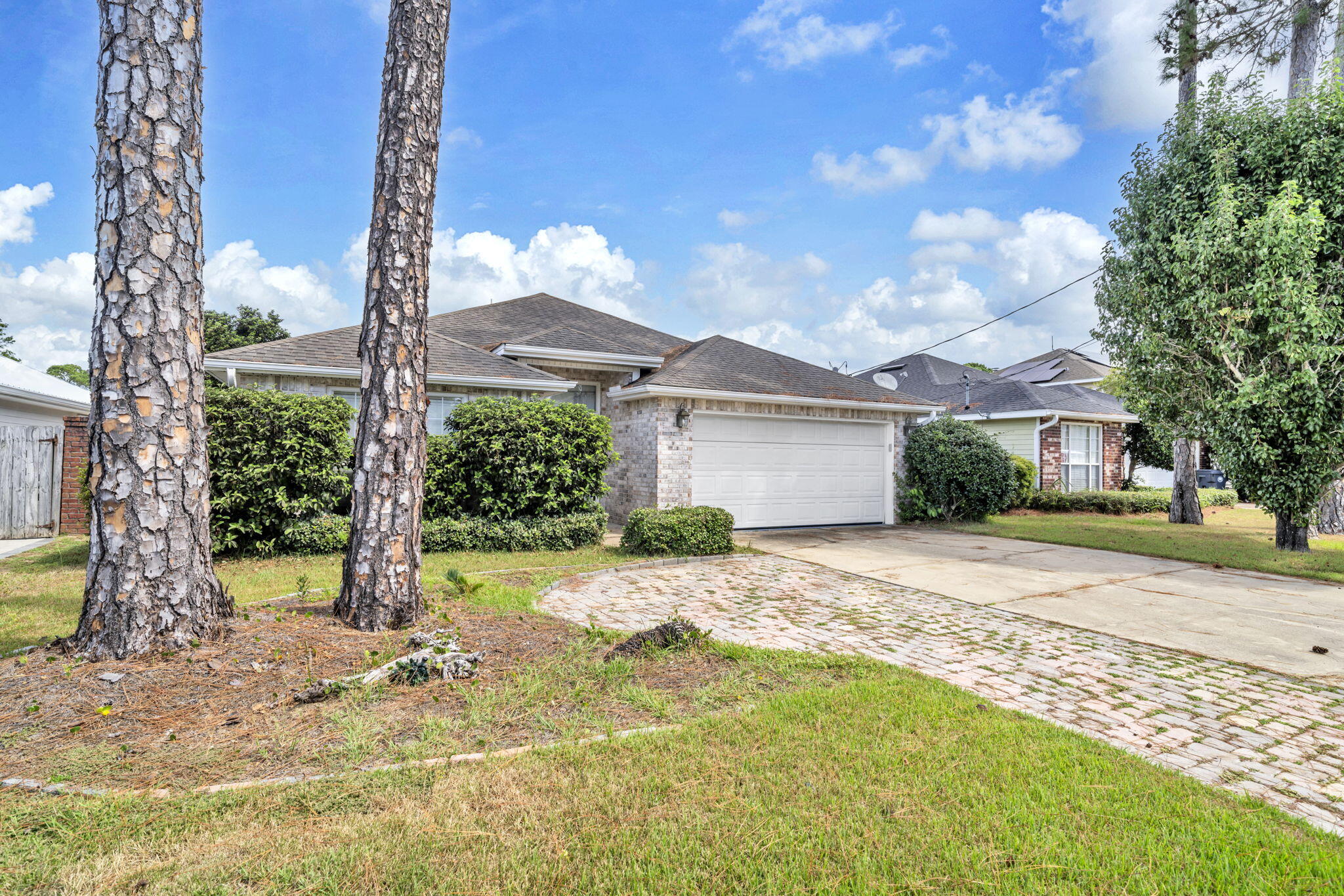 Nestled in the well-loved community of Olde Florida Lakes, this home enjoys a prime location close to the best of Santa Rosa Beach and Destin — from sugar-white beaches to local dining and boutique shopping. Inside, you'll find three comfortable bedrooms and two baths designed for easy living. Tall 10-foot ceilings throughout and a dramatic 12-foot ceiling in the living room make the home feel bright and spacious, while the fireplace provides the perfect cozy gathering spot.  The kitchen features a convenient pantry and long countertops that make meal prep easy and enjoyable.  Out back, a fully fenced yard provides the perfect play space for kids and pets or a blank canvas for an enthusiastic gardener.  The public schools are A+ rated.