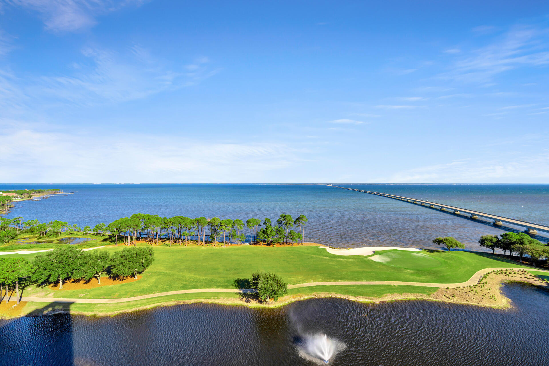 Indulge in the splendor of Bayfront living at Unit 1404, One Water Place, in the gated community of Kelly Plantation.  Newly painted walls and updated designer lighting create an elegant and airy feel to this beautiful 3 bedroom residence.  Detailed luxury walk in closets emphasize organization and make it easy to get ready for the day.  Incredible panoramic scenes of the Choctawhatchee Bay from the multiple balconies and most of the rooms of the condo, offer the perfect ambiance to relax or entertain family and friends.   The turquoise backsplash in the kitchen highlights these idealic water views.  Your private elevator opens directly into the condo, ensuring a seamless and exclusive entry experience.  This unit comes with the two best assigned parking spots in the condo.