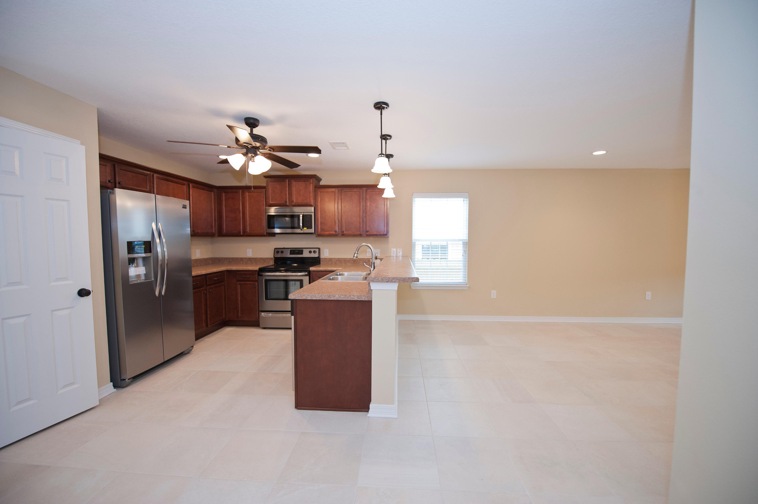 New Construction under 200k. Light and bright open floor plan. Inviting living room opens to the dining room and kitchen with stainless steel appliances to include side by side refrigerator. Downstairs Master Suite with walk in closet, dual copper sinks, garden tub, and separate shower. Downstairs has guest half bath and laundry. Upstairs are 4 additional bedrooms with nice size closets. Enjoy the covered lanai with access from kitchen opening out to the privacy fenced back yard that you don't have to cut. Lawn cutting is included in your HOA dues. Front porch offers stone columns and lush landscaping. Seller to pay up to $2600 of buyers closing cost with the use of a preferred lender. Pictures of home are not of actual home colors and finishes may vary. Estimated completion mid October