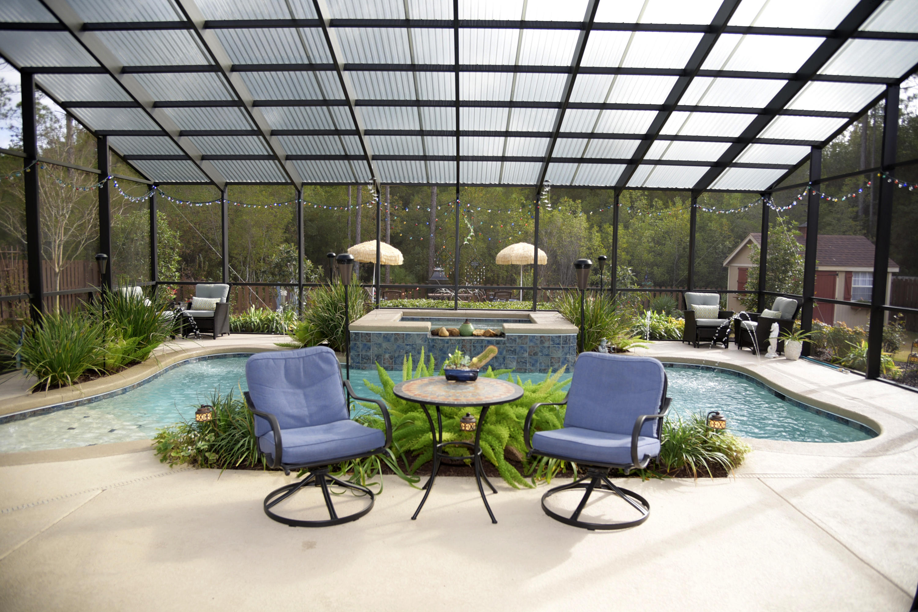 One of the nicest homes in Hammock Bay, this is a stunning, meticulously maintained property. Open, bright and airy, there is a feeling of spaciousness both inside and out.The fully fenced backyard is lushly landscaped and designed to maximize the Florida lifestyle. Relax by the outdoor fireplace, challenge someone to a game in the custom horse shoe pit, then cool off with a dip in the inground pool or the hot tub, both in the screened in lanai. Plenty of decking around the pool provides space to entertain, enjoy a meal or visit with family and friends.  Inside, most rooms have high trey ceilings, crown molding, beautiful hardwood flooring, and upgraded lighting fixtures. In the well appointed chef's kitchen, there is a large island for food prep and casual dining. Custom granite countertops, stainless appliances, a gas cooktop and oven, under counter lighting and a large pantry add to the space. The master bedroom is large and the master bath has 2 vanities, a soaking tub, shower and much more. With 3 additional bedrooms and 2 more baths, accommodating overnight guests, or additional family is a cinch! The home also has a gas powered tankless water heating system and various extra elecrical outlets and features. There is a large custom built shed with electricity for both storage and projects or hobbies. The photos of this outstanding property tell the story. Please review the Features and Upgrades in the Documents section for a more complete explanation of what makes this home so special. Call for your private appointment to see and consider this lovely residence in one of the best communities in northwest Florida.