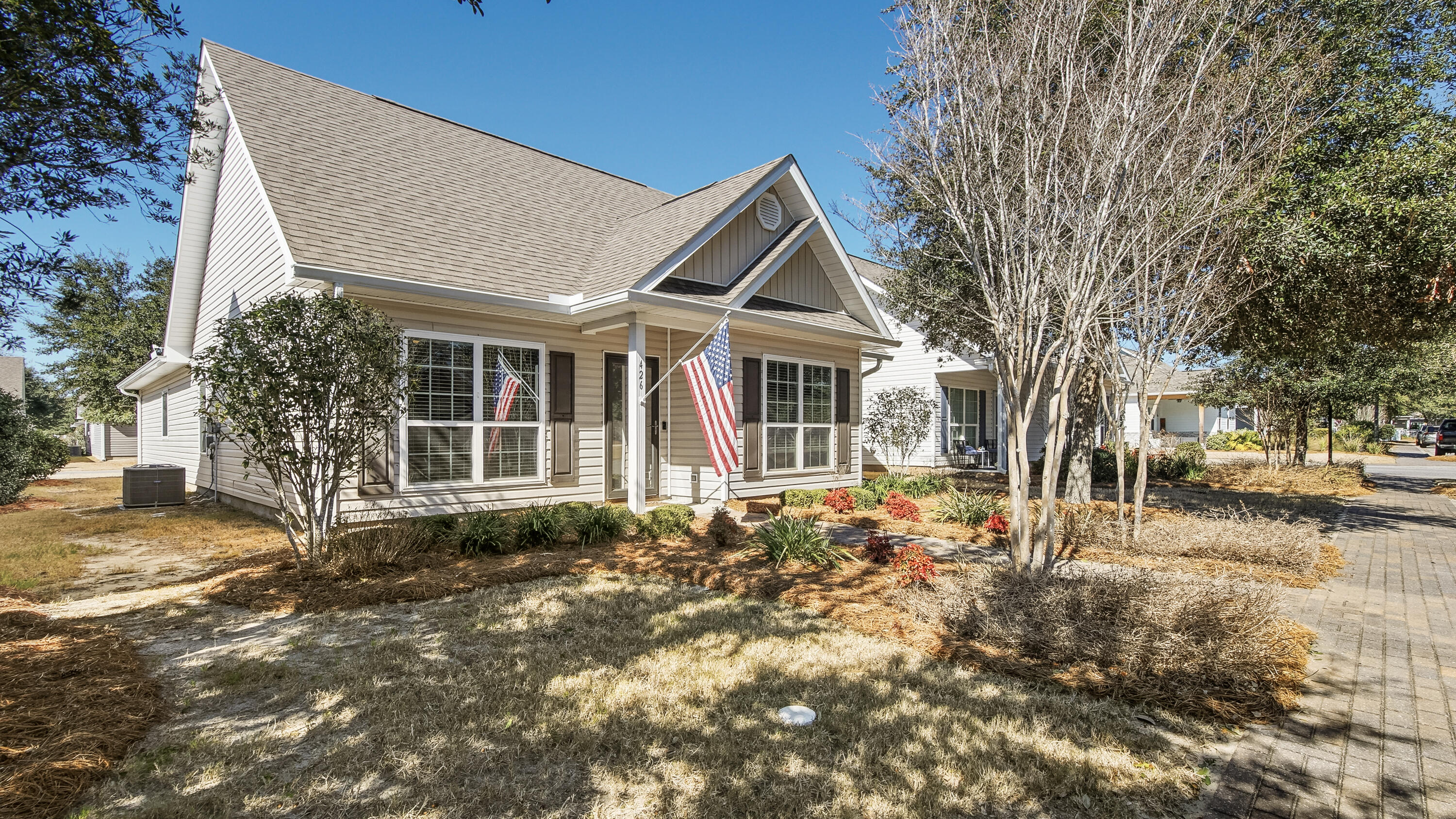 When location is everything! This 3-bed, 2-bath cottage nestled in the heart of Hammock Bay is thoughtfully upgraded. Home offers modern living without sacrificing charm. Kitchen serves as heart of home, featuring granite countertops, pendant lighting, custom 42-inch cabinetry, and striking stone tile backsplash. Stainless steel farmhouse sink on large island creates ideal space for meal prep and gatherings. Primary bathroom showcases cultured marble vanity and a trendy barn door that adds distinctive character. Peace of mind comes standard with hurricane wind screens, whole-house surge protector, and heavy-duty security storm door. AC capacitor replaced in 2022 and garage offers built-in workbench. Within walking distance of pool, fitness center, athletic courts and restaurants.