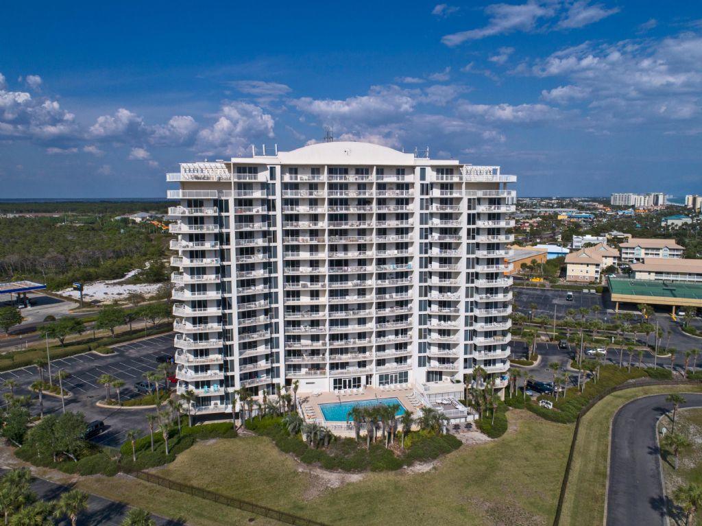 Enjoy the beautiful views and gorgeous sunsets from this second floor location at The Terrace. Easy access. Kitchen counters are upgraded with white Corian. The entire unit is tiled. Three spacious bedrooms make this the perfect location for the many weddings that book with us throughout the year.The Terrace shares a cross easement with Pelican Beach Resort. We offer 3 conference rooms,catering and lots of social activities. Many of our snowbirds have been coming here for over ten years. We offer free tram rides in season to the beach for all guests at the Terrace or you can walk the boardwalk in 3 minutes. Amenities include,tennis,3 pools, spa, sauna, tiki bar, cafe,game room and planned activities for our snowbirds like water aerobics,pot luck dinners and other social functions.