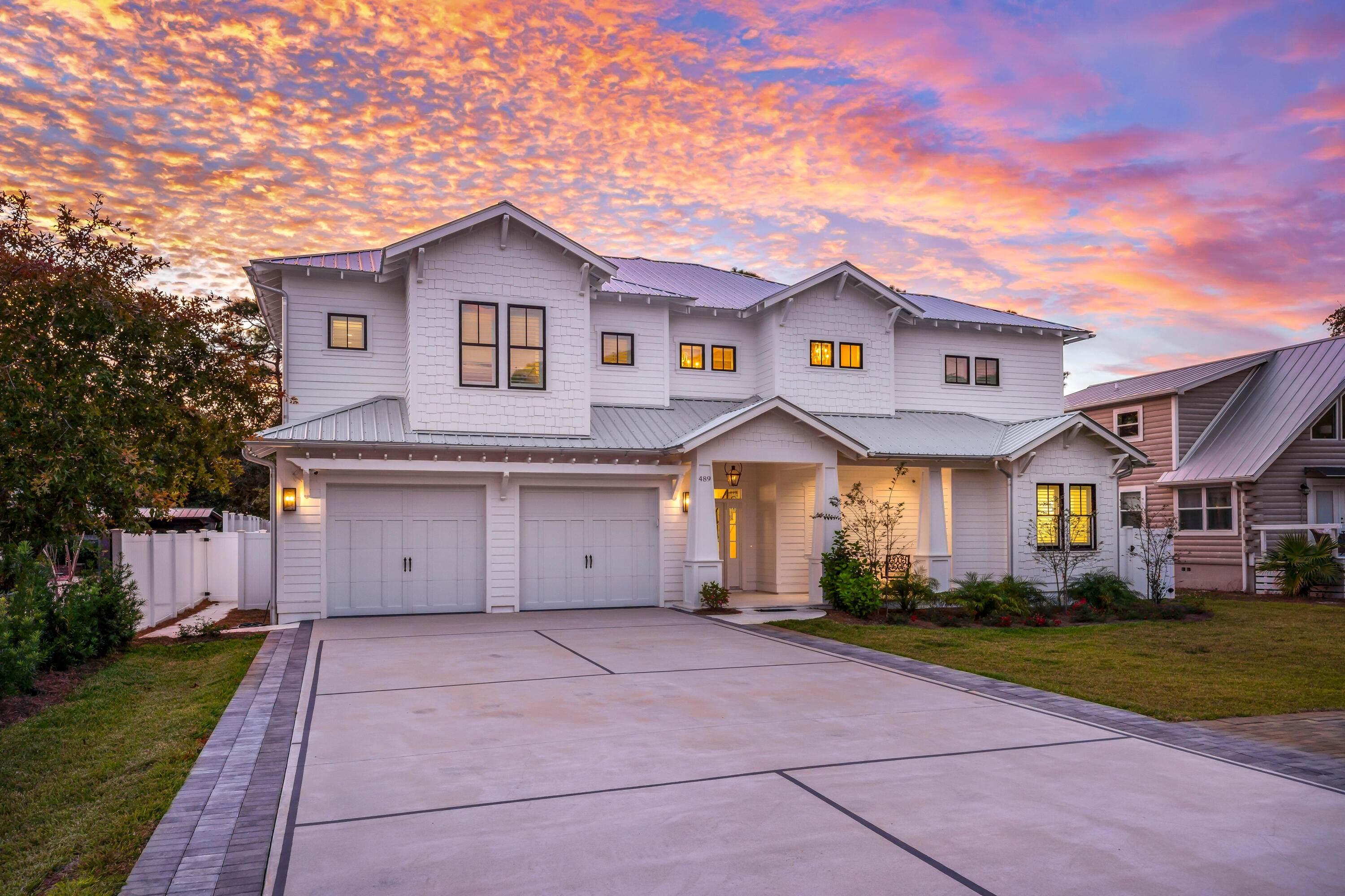 Welcome to 489 Seacrest Drive on 30A, just moments away from Rosemary, Alys Beach and Camp Creek Golf Course. Wonderfully appointed and custom built home has numerous special features above typical homes, Completed in late 2022, this home spans just under 4000 square feet and sits on 0.24 acre with a on-site pickleball court, large 30x10 heated pool, fenced back yard, and plenty of parking for family, friends and guests. Located semi-privately on the north end of the street near the state forest, this newer home could be ideally used as a primary residence, private second home, or income producing vacation rental. Upon entering, you'll immediately notice custom attention to detail with designer touches all around in the flooring, lighting, wall appointments, custom counters, safe room... and comfy furnishings. On the first floor, you'll notice a bright and welcoming living, dining and kitchen area each thoughtfully laid out for an excellent flow to the home. Off the main living space, you'll find the main/first floor master bedroom complete with sitting room, safe room, large master bath, and a walk-out leading a wonderful outdoor space to enjoy the evenings year round - a covered, screened patio with couches, grill, cozy gas fireplace and space for an outdoor TV for movie nights or that big game. Also off the first floor, you'll find a welcoming foyer, half-bath for guests, and large mudroom/laundry off the spacious two car garage. 
From the foyer, up the stairs, you'll immediately notice the wooden beams nearly 20 feet overhead at the second floor landing, flanked by wainscoting along the stairwell. Here, we have four additional bedrooms, including another upstairs master and a bunk room. Beautifully appointed bathrooms are accessible to each bedroom, and a large second floor balcony overlooks the pool, outdoor gas fire pit, and backyard.
489 Seacrest is a beautiful custom home perfect for those considering a beach home with rentability, thoughtful design, custom touches, and steps to the beach, Alys, Rosemary, Camp Creek and so much more at a great price point. Buyer to verify all details and measurements.