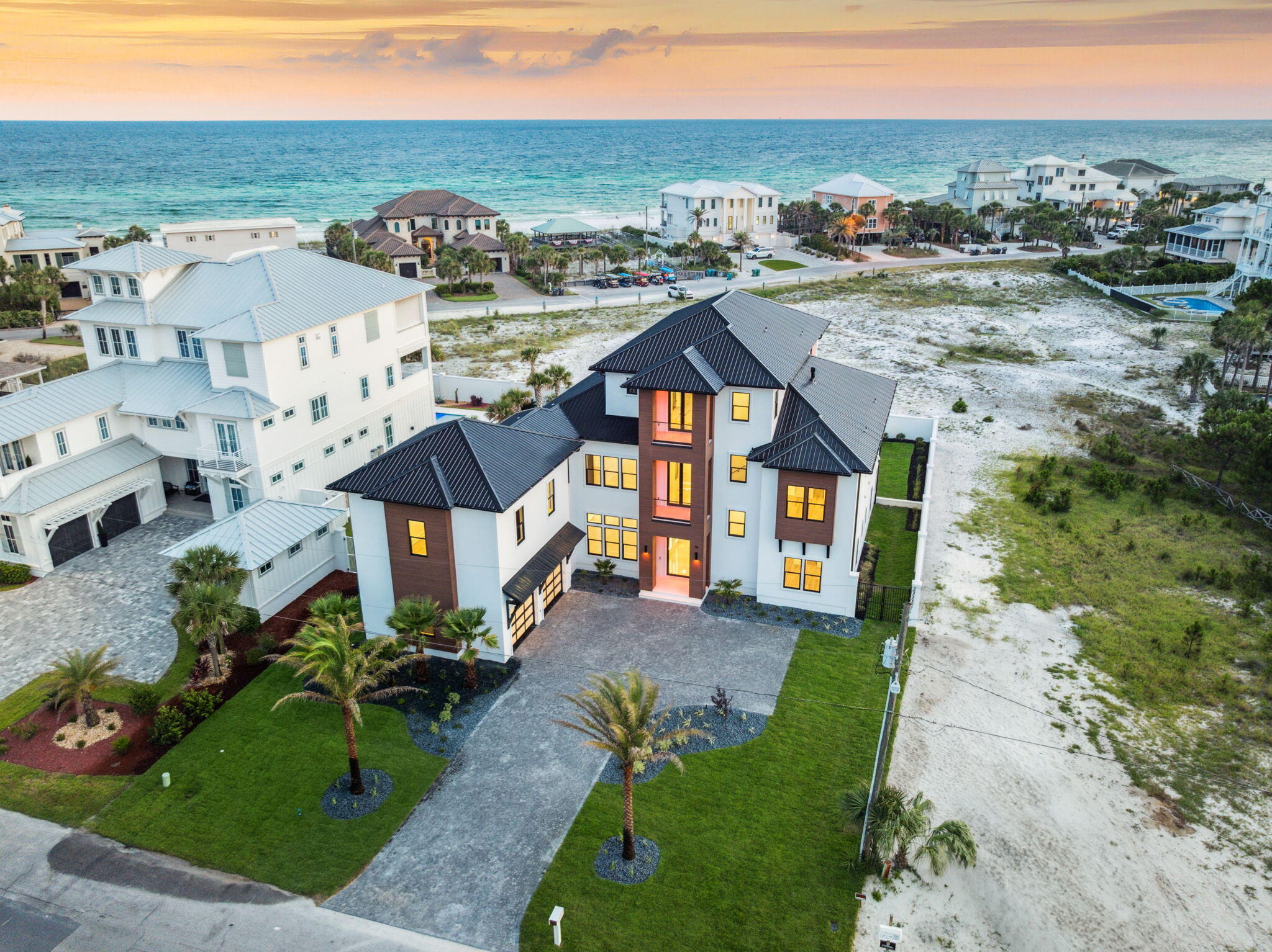 Luxury Modern Estate with Expansive Gulf Views. Welcome to a one-of-a-kind Boswell built luxury retreat where modern finesse meets coastal serenity. 

Nestled along the pristine shores of the Gulf of America, this architectural masterpiece offers breathtaking, nearly unobstructed views of the Gulf from nearly every vantage point. The area behind the home cannot be built on ensuring Gulf views for the future of this home.

Boasting high-end finishes throughout, the home is thoughtfully designed with both style and functionality in mind. This Smart-home-enabled residence features an in-home elevator that seamlessly connects all levels. Outfitted with the advanced Control4 Whole House System, it offers unmatched convenience, customization, and centralized control throughout the home. The main living area opens to a chef's dream kitchen outfitted with state-of-the-art Thermador appliances, sleek cabinetry, and a hidden butler's pantry for seamless entertaining

A temperature-controlled wine room and a fully equipped theater room elevate the lifestyle experience, offering refined spaces for relaxation and leisure. The home also features a guest suite complete with a full kitchen and living space.

Designed for entertaining, the expansive recreation room leads directly to the outdoor oasis, featuring a large perimeter overflow pool, spacious sun deck, and lush modern landscaping as well as a fully equipped outdoor kitchen. Oversized outdoor balconies provide the perfect setting to enjoy sunsets over the Gulf. This home also features a whole house generator.

The master suite, located on the third floor, is a sanctuary of luxury, complete with large sliding doors for awe-inspiring Gulf views, a spa-like en-suite bath, and a custom walk-in his and her closet. 

Elevated touches like large-format main tiles, warm cypress wood accents, and designer lighting enhance the home's modern aesthetic, while every detail, from the spacious layout to the thoughtful finishes, reflects unparalleled craftsmanship.

This estate is not just a home; it's a lifestyle. Schedule your private tour today and experience the pinnacle of modern luxury.