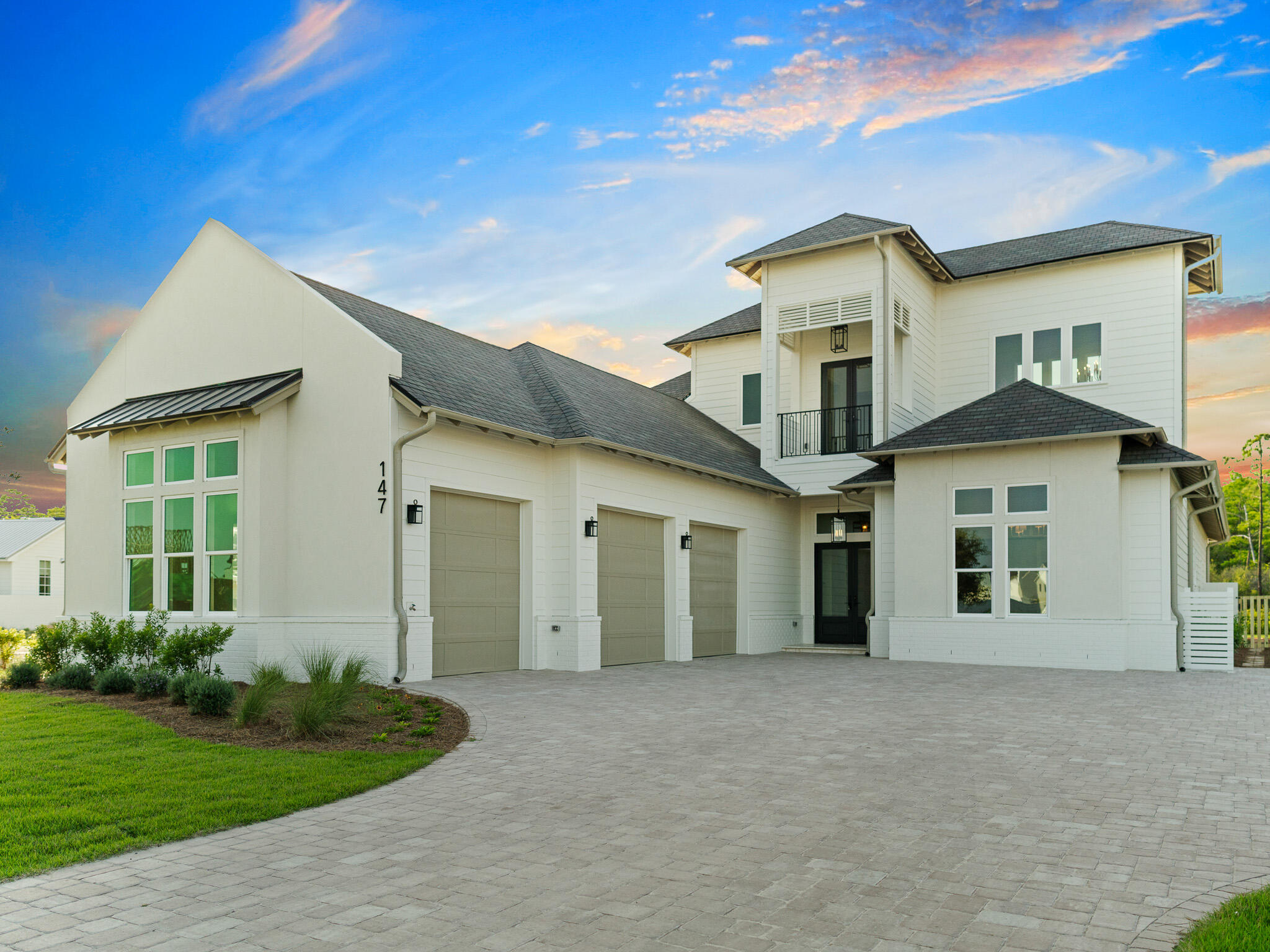 Designed by renowned architect John Williams, this elegant new construction nestled behind the private gates of Camp Creek features impressive craftsmanship with a tasteful coastal flair throughout. A chef's dream, the kitchen encompasses custom milled cabinetry, an oversized island, quartz countertops, and a luxury appliance package with gas range. The expansive living and dining areas are perfectly positioned off the kitchen with direct access to the covered porch with outdoor kitchen effectively blurring the lines between indoors and out while creating a true continuation of living and entertaining space.