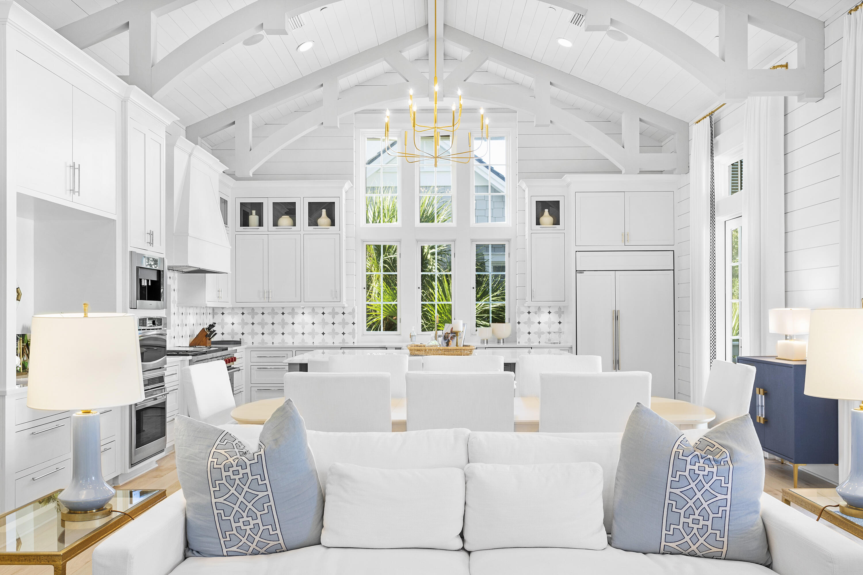 72 S Founders, designed by the renowned architect Geoff Chick, is a spectacular beachside retreat located within the gates of the exclusive WaterSound Beach community. This custom home is immaculate, having recently undergone a complete re-imagination compliments of Summer House Lifestyle. No surface went untouched.  

The impressive great room sets the tone for this sophisticated beach home. The soaring vaulted ceilings and custom beams add to the great sensation when entering. The oversized kitchen island is perfect for preparing meals and hosting friends, and the Soho Studio tile backsplash adds the perfect pop of color to this entertainer's dream of a space. The living space is accented by custom-ordered furnishings courtesy of Restoration Hardware, Bungalow 5 and Modern History. The custom drapes, pillows and cushions are all creations by Thibaut designs. The lights, sounds and temperature in this impressive room (as with the rest of the home) are all controlled via your phone or the installed iPad operating the Control4 system. The oversized pantry and washroom are just off the great room, along with a half bathroom designed to add some flair to the home.   

The primary suite on the main living level is an inviting retreat with private access to the screened-in outdoor living area. The bathroom boasts a soaking tub and multi-jet shower with rain head above. The Thibaut wallpaper adds a custom touch to this room, and the dual walk-in closets complete the suite.

This level also showcases the climate-controlled wine cellar, complete with reclaimed wood racks that can hold more than enough wine for all guests. Just outside the wine room is the oversized screened porch. This entertaining outdoor area has a vast custom wood dining table, beverage drawers, built-in Wolf Grill and hood, plus an oversized TV. On the other side of the porch is the fully independent carriage house. This suite has a kitchenette, a built-in dining area, and a separate living area. Elevated ceilings and ample windows create a sense of wow for this living quarters. The Kelly Hoppen canopy bed will tempt you never to leave this room.  

The first level boasts a grand entry hall with custom inlaid marble tiling and an overhead chandelier created by Arterriors. Dual guest suites on this level both have en suite bathrooms. Both bedrooms are highlighted by John Robshaw bedding, Matouk and Thibuat pillows and drapes, and art by renowned local photographer Modus Photography. Rugs by Dash & Albert cover the floors, and new quartz vanities and Waterworks plumbing round out these beautiful guest suites.  

Just down the hall is an additional bedroom doubling as an in-home office space with an attached full bathroom, equally appointed as the other guest suites.  

This level is completed by a bonus entertaining room that works for additional sleeping accommodations. Pull out the sleeper sofa and pull down the retractable viewing screen to create the perfect movie-watching spot. The linens, pillows, rug and artwork are all on par with what you would expect in a home of this calibre.   

Outside the theatre room, you find the first-level outdoor living area featuring an outdoor fireplace, sitting area and spa. The large spa with a spillover edge and waterfall feature create a wow factor upon approaching the home. 

Climb the stairs or take the elevator to the third level. You find a sitting area separated from the bunk room by a vast custom barn door. Built-in bunks provide additional sleeping for family and friends, and a full bathroom completes this level. There is one more set of stairs to climb to the enclosed watchtower. Here you find lounge-level seating plus a bar top and stools looking through the windows and out at the Gulf of Mexico. 

When it is time to go to the beach, hop on your private golf cart (included in the sale) and drive right down the the beach! The large "Dunesider" pool is just steps away (less than 150 to be exact) with poolside lounging and a seasonal cafe.  For more activity, the private exclusive WaterSound Beach Club is conveniently located right next door with multiple pools and dining options.

This home has strictly been used as a vacation home; never a rental. 

WaterSound Beach is the premier gated Gulf front community on Scenic HWY 30A, offering nearly 1 mile of unspoiled private beach. Picturesque wooden boardwalks meander throughout the community, all leading past puttering parks, ponds and streams and ultimately to the white sand beaches the area is known for. The private beach club is next door, along with numerous restaurants. 72 S Founders is tucked away, privately behind the gates of WaterSound Beach, but is conveniently close to all the restaurants and shopping the 30A area offers.