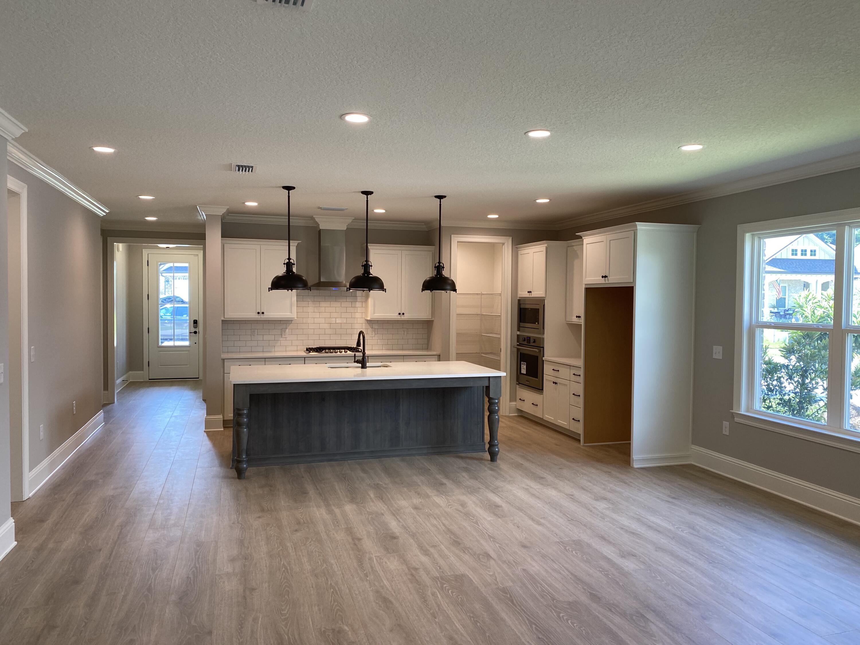 New construction ready for move in by award winning local builder in sought after Osprey Ridge community off Bayshore drive in Niceville.  Minutes from Niceville High School and Ruckel Middle School.  Home features laminate wood floors throughout with 8' doors, cased windows, crown moulding and 5' base boards.  Study with full bath features beautiful French doors.  Kitchen is a cooks dream - open to family room with large island, 5 burner gas cooktop, built in oven and built in micro wave with walk in pantry.  Master bathroom includes quartz counter tops and large walk in shower with 2 shower heads.  Great back yard with room for possible pool and screened porch.  This is a rare opportunity!!!