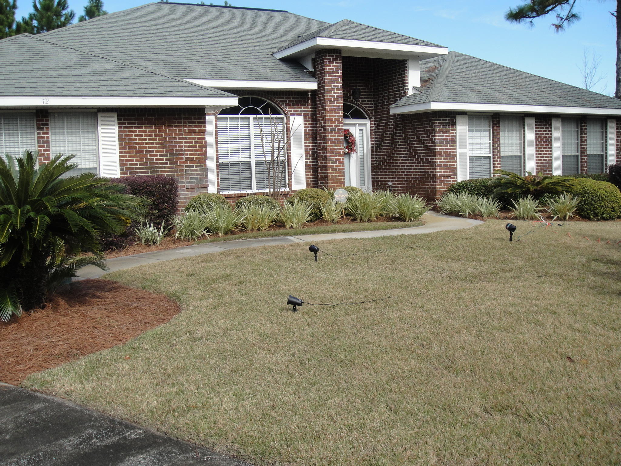 Beautifully maintained spacious 4 bedroom 3 bath family home on a large 1/2 acre lot close to Grand Blvd's shops and restaurants. All bathrooms were recently updated with granite, new vanities, hardware, lighting and toilets. The large tiled kitchen features new stainless steel appliances, pantry and new granite breakfast bar. The family room features a fireplace and vaulted ceilings. There are 6 ceiling fans throughout the home and there are separate dining and formal living areas. The over sized master bedroom and attached master bath with dual vanities also has dual his and hers closets. There is a security system complete with motion detectors and window sensors. The tiled back patio overlooks a large fenced yard that backs up to a green belt and has plenty of room to add a pool.