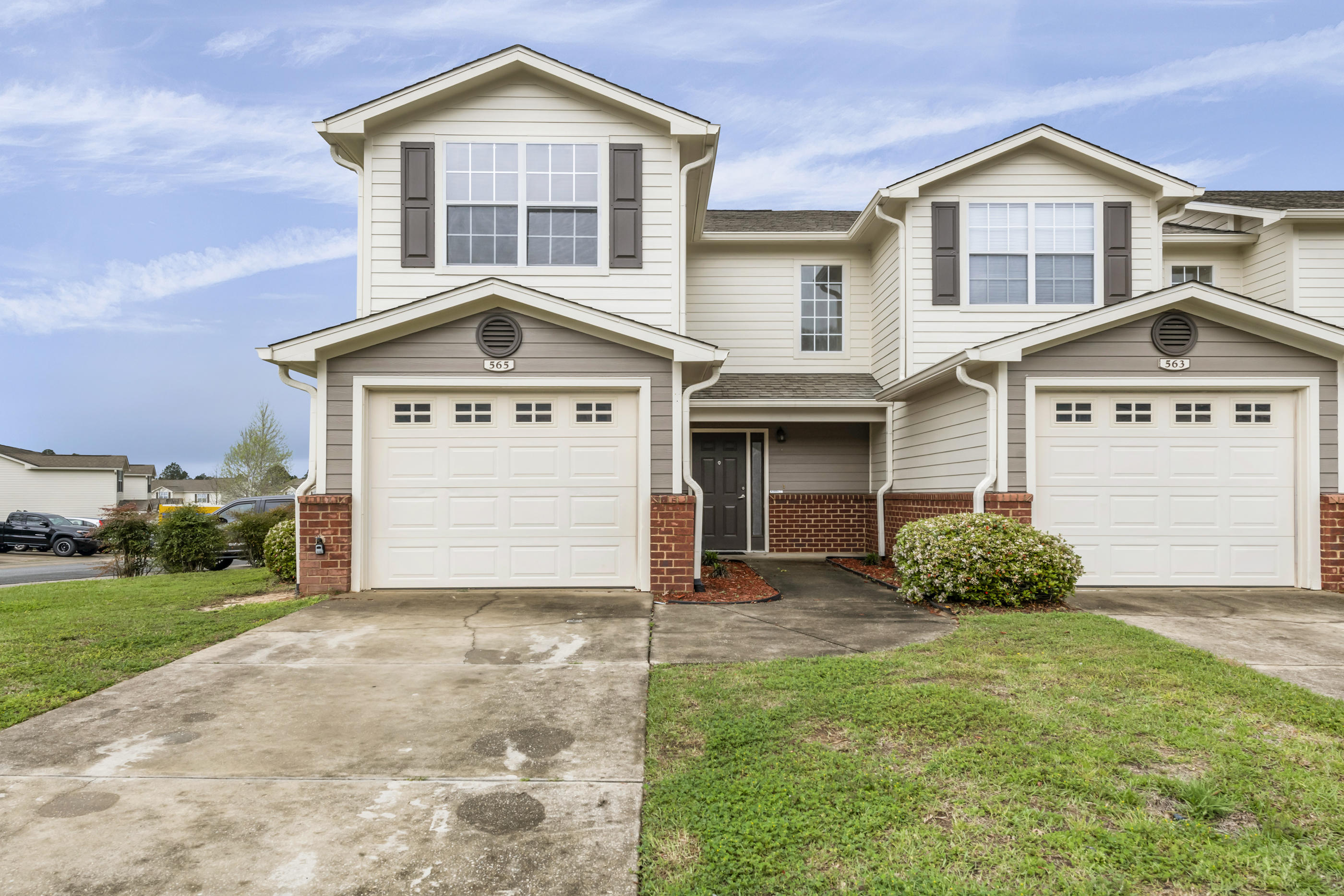 This is beautiful end unit, just steps from the community pool and clubhouse. The kitchen comes equipped with all appliances (side by side refrigerator, oven, microwave, dishwasher) as well as a garbage disposal. Little ''extras'' such as an AC/Heat system with controls for both levels and crown moulding make this feel like home. French doors lead to your patio where you can enjoy the beautiful lawn that is maintained for you...that's right, no need to mow. The street lights, sidewalks and underground utilities make the community feel clean and well-kept. In addition to the superior quality of construction and the affordable price, the location is unbeatable--South of I-10 means no sitting in traffic!