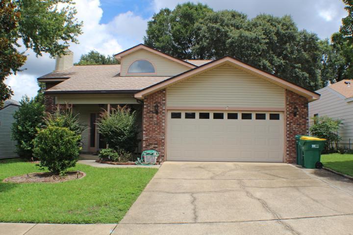 Move-in ready! Two story, three bedroom home with a large useful loft. Soaring ceilings and fireplace are just a couple features that enhance this home. Your covered front porch greets you as you enter this home. The master bedroom suite is on the first floor and the master bath features double vanity, separate shower and tub, and a large walk-in closet with built-in shelves. The two additional bedrooms are on the second story with large loft overlooking the living room below. Kitchen boasts a small dining area with a built-in desk and garden window overlooking the fenced backyard. Recently installed front and back lawn nurtured with plants, flowers, and small trees for shade. The entire interior of the home has just been professionally painted in a warm neutral color. Enjoy your evenings relaxing in the screened-in patio just off the dining room. Located in the delightful neighborhood of Cedar Ridge featuring sidewalks and street lights. Walking distance to Northwest Florida State College, Niceville High School, Ruckel Middle School, Niceville Community Center, Children's Park, and Library. Stove, furnace, washing machine, and water heater are natural gas appliances. Washer and Dryer are included in the unit however they are not warrented.