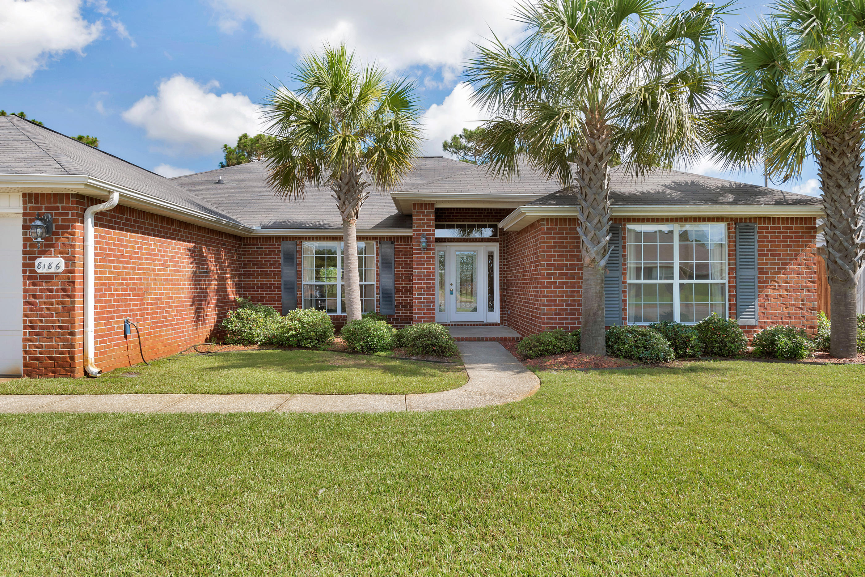 This spacious move in ready home is vacant and ready for new owners. As you enter the front door you are greeted with an abundance of natural light. The formal dining room has plenty of room for large gatherings, The spacious living room is open to the kitchen and breakfast bar area. The master bedroom has plenty of room for all your large furniture and features two walk in closets. The over-sized master bath has dual vanities, a garden tub and separate shower. The split bedroom floor plan provides for privacy. The back yard is fenced and has plenty of room for a pool. The washer and dryer convey AS-IS. The home is protected by hurricane shutters and the seller will provide a home warranty with American Home Shield for $660 for the Buyers peace of mind.