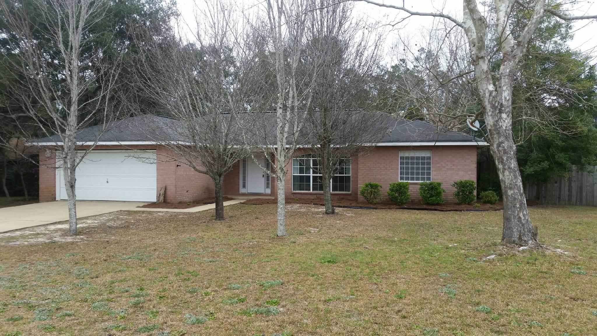 New Roof, A/C & carpet. All brick and fenced! An open and split floor plan in Holley By the Sea! Three bedrooms, two baths, and a beautifully wide and spacious entry and foyer area. Windows that bring in the perfect amount of lighting. The open and split floor plan features: cathedral ceilings, fireplace, breakfast bar, eat-in kitchen, and a formal dining room. The Large master-suite bath has a double vanity, whirlpool tub showcased under a decorative-block window. A separate shower and two walk-in closets. A large backyard, and a 2-car garage. An HOA with access to the multi-million dollar Rec Center with pool, gym equipment, steamroom and so much more for your enjoyment compliments the purchase, as a bonus to ownership . A must see home before you decide on your dream property!