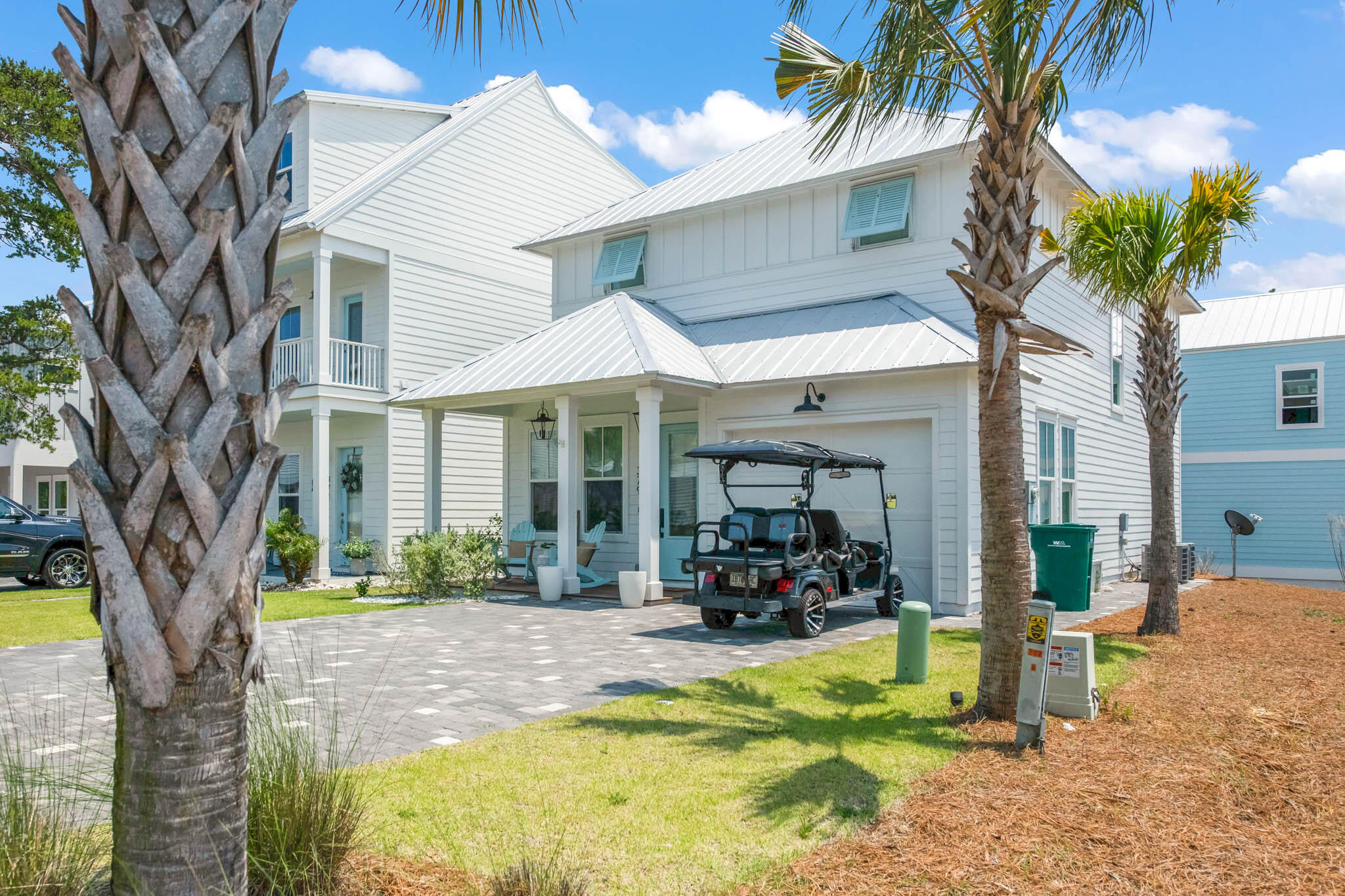 Coastal living at it's finest. Short stroll to the newly constructed beach access.  This lovely home features many extras including, GE Cafe appliances, hardwood floors, two master bedrooms,  Epoxy coated garage floor, Ipe decking on front porch, upgraded lighting and so much more.   Fully furnished and ready to enjoy.