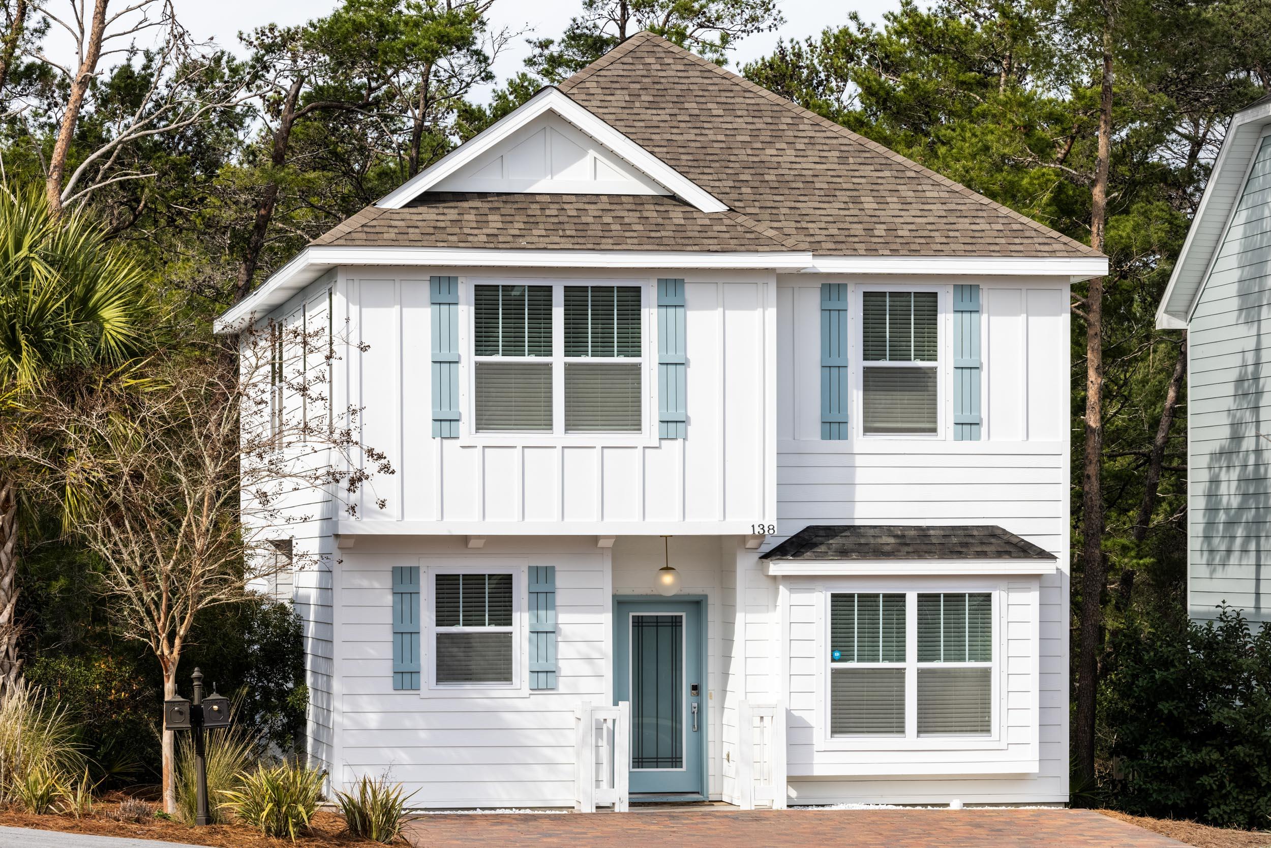 Welcome to 138 Sandpine Loop, a contemporary 4 bedroom, 3 bathroom home located a short bike ride, walk, or golf cart ride from 30A, beach access, and fantastic dining. The entire home was repainted in January- walls, trim, and doors. The first floor offers an open space that encompasses the kitchen, dining, and living areas.  From the front door, this open space, its tall ceilings, crown molding, and recessed lighting invite you inside. The kitchen was designed using upgraded quartz countertops, sleek Maytag stainless appliances, beautiful gray wood cabinets, and modern gold lighting fixtures, sink faucet, and cabinet hardware. Dark hardwood floors run through all common areas and all bedrooms- no carpet to replace or clean. Also on the first floor is a guest bedroom, full bathroom, and a covered deck accessible from the living area and kitchen. Situated upstairs is three bedrooms, two bathrooms, and a nice sized loft that could be used as a living or play space. The master bedroom has trayed ceilings, recessed lighting, and a walk in closet. The master bathroom is generously sized with a linen closet, double vanities and a shower crafted using gray subway tiles, and a frameless glass door. All three bathrooms have beautiful oblong neutral tile floors and granite countertops. This home is located across the street from the community pool. Pinewood Preserve is a small, quaint neighborhood located in sought after Inlet Beach just east of 30Avenue, the east side of 30A/Rosemary Beach, and blocks from the beach. Its proximity to amenities and the beach make it a highly desirable primary residence, vacation home, or investment property. Buyer to verify all room dimensions.