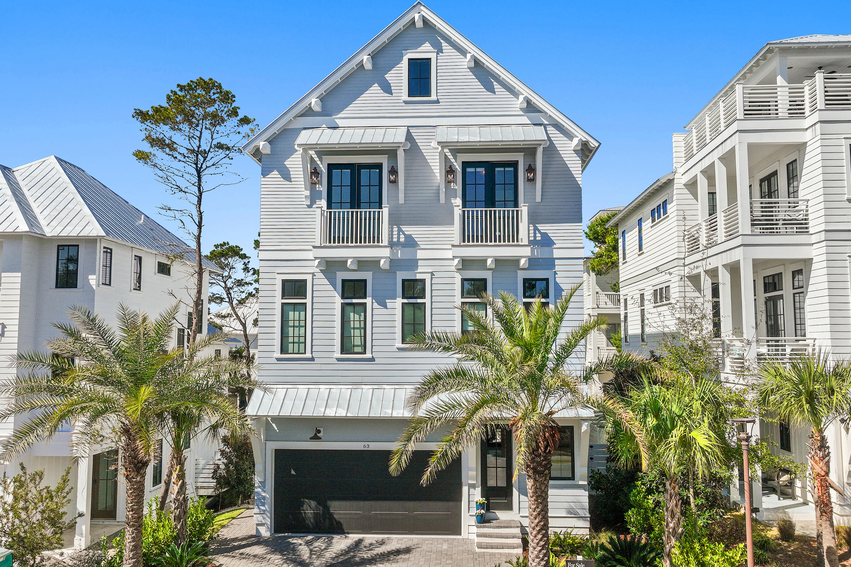 Poised within one of Inlet Beach's most refined enclaves, 63 Grande Pointe is a study in balance--architectural precision softened by the rhythm of coastal life. This residence recently staged by the team at Lusso Interiors pairs timeless design with modern intent, offering five bedrooms and four baths across light-filled spaces that feel both expansive and intimate along with a private outdoor oasis that feels serene. Sunlight easily moves throughout the main living areas, revealing layers of craftsmanship in every finish and fixture. The open floor plan encourages connection, yet private suites throughout the home create a sense of retreat, a design equally suited for quiet mornings or full gatherings of family and friends.

The home's rooftop deck and outdoor kitchen area elevate everyday living with a rare asset, protected and unobstructed views perfect for catching the renowned Emerald Coasts sunrises and sunsets. The view corridor has been intentionally safeguarded, ensuring future construction within the Grande Pointe community cannot impede the sweeping vistas enjoyed from this elevated deck. 

Every detail inside the home reflects quality, and materials chosen for longevity and luxury, spaces arranged for light, and architecture that belongs to its setting rather than imposing upon it. The result is a home that feels intentional- crafted for those who value design but live for experience.

Grande Pointe itself is a sanctuary. Tucked between Lake Powell and the Gulf of Mexico, this private community offers residents access to a heated pool, pavilion, and dock overlooking the rare coastal dune lake. The sought-after community provides residents with a quick walk to the beach and lake, heightened privacy, and an array of amenities while remaining geographically poised near all of the acclaimed dining and entertainment venues 30A has to offer including the newly opened 30A Avenue town center with an underground tunnel connecting you to the 30A corridor and beaches of the Emerald Coast. 

With impressive rental potential annual revenue projections exceeding $150,000/a year, 63 Grande Pointe presents an outstanding opportunity for investors and those seeking a second home or full-time residence.

Furnishings sold separately - Inquire today to arrange a viewing and start envisioning the coastal lifestyle you deserve.