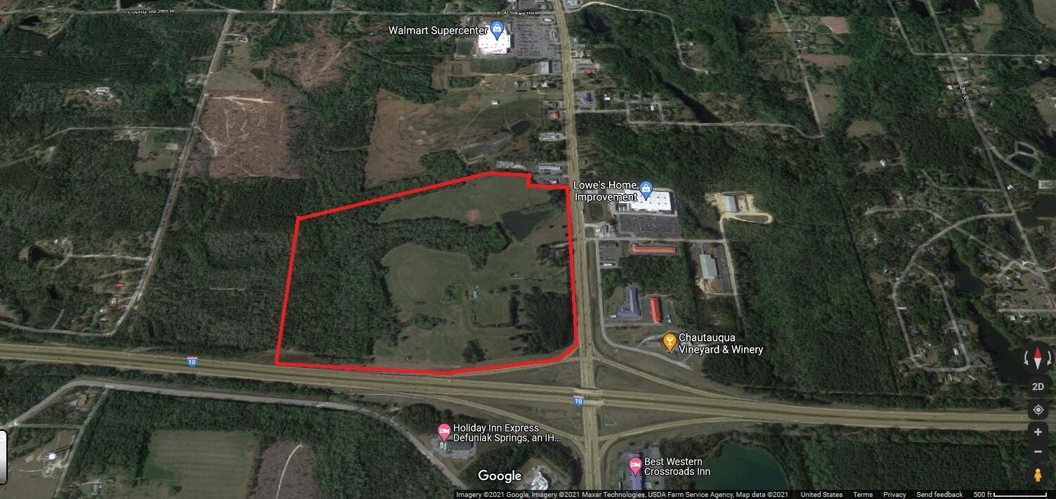 This apex location parcel at the junction of 331 S and Interstate 10 in Defuniak Springs is a developer's dream. 94.7 acres (110.4 per GIS map) with an estimated 75+ developable uplands (wetlands estimated at 20+ acres) is co-zoned commercial and residential (16 units per acre) for maximum value and use. This longtime family farm property has a prominent lake on the eastern side and forested wetland stream areas to the west. The property is the cornerstone parcel of the commercial zone along 331 in south Defuniak Springs with Walmart and Lowes along the same stretch and falls within the City of Defuniak Springs zoning jurisdiction. On the south side of I-10, almost 3,850 residential units are planned by several development groups. The approximate one acre parcel on the south side of I-10 and billboard lease will convey. Buyer to verify all information for its intended purpose.
